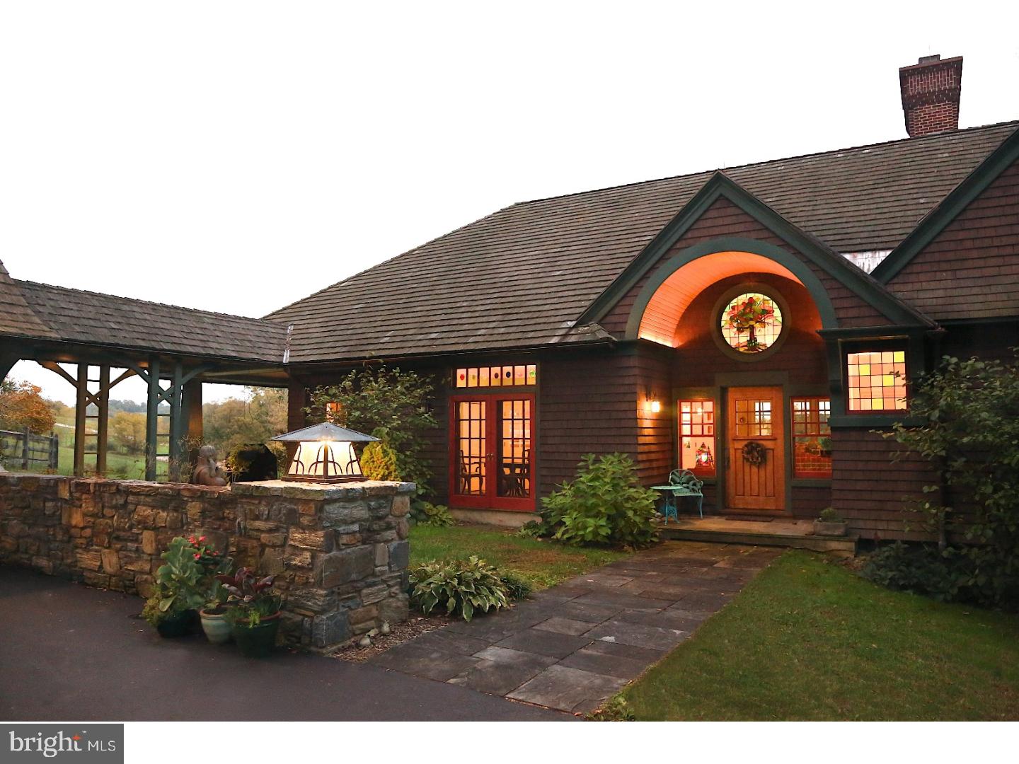 Stunning one of a kind Shingle style home designed by noted architects Archer & Buchanan & built by Griffiths Construction on a bucolic 3 acre site. A winding driveway leads to the sunlit house overlooking 500 acres of Natural Lands Trust's Stroud's Preserve. About half the property is woodsy, meaning not much lawn to cut! The long spectacular views in every direction will never change. As you walk from foyer into the living room, your eyes are drawn to the wall of curved windows with the WOW view over conservation land. Please note the outstanding millwork and gas fireplace. Enjoy winter evenings by the wood burning fireplace in the library with floor to ceiling shelves and glass front lighted cabinets. The inviting dining room has French doors to a front garden, built in bar w/Marvel wine fridge, and built-in china closet. Pass through the butler's pantry with lots of storage & pantry closet to the kitchen featuring a stunning oiled hickory island, cherry cabinetry with soapstone and granite counters, dual sinks & Bosch, Dacor, Sub-Zero and Thermador appliances. French doors lead to a screened porch and southern facing terrace, again with that million dollar view. A hallway from the LR leads to the master bedroom with French pocket doors to a delightful sleeping porch/sitting room, and stairs to an enclosed outdoor shower! Seldom seen His and Hers master baths are sure to please with radiant heated floors in both, soaking tub in Hers, and oversized shower, heated mirror and towel bars in His. Upstairs is an office/sitting room overlooking the foyer, 2 ensuite guest bedrooms, huge walk in cedar closet, and abundant attic storage. Above the 3+ car garage is the 4th bedroom, full bath, and good sized sitting room/office with builtins. Just what you need in-law suite, nanny quarters, or extra bedroom for guests. The pool is privately situated overlooking open space and has a covered patio and changing room. The basement is plumbed for bath & ready to finish with abundant windows and an arched double door into radiant floored area for the car enthusiast or hobbyist. Minutes from West Chester borough & convenient to Wilmington and Septa/Amtrak trains. The best of everything has been thoughtfully incorporated into this exceedingly happy house. The owners' superb taste, attention to each small detail, and their good stewardship make this a very special and welcoming place for the lucky new owner