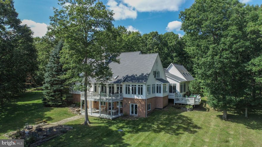 Home Sweet Home! How about 7000+/- square feet of one of the warmest and inviting traditional style homes you will ever see! Perched on two acres overlooking Deep Creek Lake with fantastic lake access, and an assigned boat slip. The coveted location of Pergin Farm definitively reflects what one would look for in a mountain lake estate.