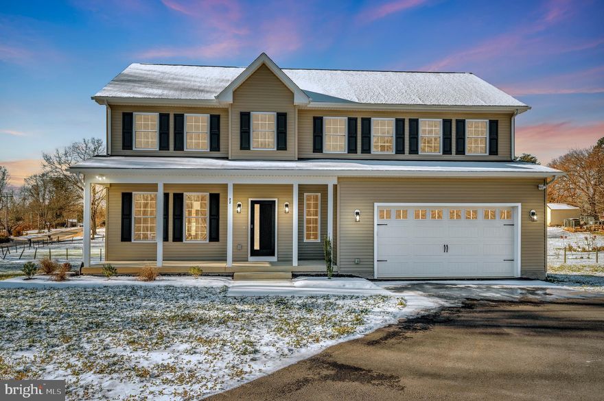 Exquisite New Construction Estate on Acreage | No HOA. Experience refined living in this impeccably crafted new construction home, set on a pristine, flat acreage lot offering expansive front yard space, a charming front porch, and country views. From the moment you arrive, the striking contemporary front door sets the tone for the elevated design and meticulous attention to detail found throughout.The main level showcases rich hardwood flooring, a dramatic two-story foyer, and elegant formal living and dining rooms adorned with crown molding, custom paint, upgraded designer lighting, ceiling fans, and an abundance of recessed lighting. A beautifully appointed powder room features a full vanity and window, while the garage entry offers a thoughtfully designed drop zone for everyday luxury and convenience.Designed for both entertaining and everyday living, the open-concept floor plan seamlessly connects the family room and gourmet kitchen. The chef’s kitchen is a showstopper, featuring quartz countertops that extend into the backsplash, a generous island with seating, statement pendant lighting, stainless steel appliances, pantry, and sophisticated black hardware and accents. The family room offers ample space for oversized furnishings, enhanced by recessed lighting, a ceiling fan, and a contemporary electric fireplace with a designer mantel.Hardwood floors continue throughout the upper level, complemented by elegant wood staircases and upgraded iron balusters. The lavish primary suite is a true retreat, offering expansive his and her walk-in closets with custom wood shelving and a spa-inspired en-suite bath. Indulge in the double vanity with upgraded lighting, beautifully curated tile selections, a seamless glass walk-in shower with custom niche, and a luxurious soaking tub with overhead shower. Three additional generously sized bedrooms and a refined hall bath with dual  sink vanity, upgraded tile, and designer mirrors complete the upper level. Custom interior doors throughout the home further elevate the architectural detail. The fully finished lower level extends the home’s entertaining space with coordinating luxury LVP flooring, abundant recessed lighting, a full bath with upgraded vanity, tile, and fixtures, bedroom or flexx bedrooj                                                                                                                                                                                                                                                                                                                                                                                                                                                                                                                                                                                                          and walk-out access to the backyard. The main level opens to a spacious deck—perfect for enjoying tranquil county views and outdoor gatherings.Enjoy the serenity of country living while remaining conveniently close to shopping, dining, and top-rated Stafford County schools. With no HOA, this exceptional property offers the ultimate blend of luxury, privacy, and freedom.