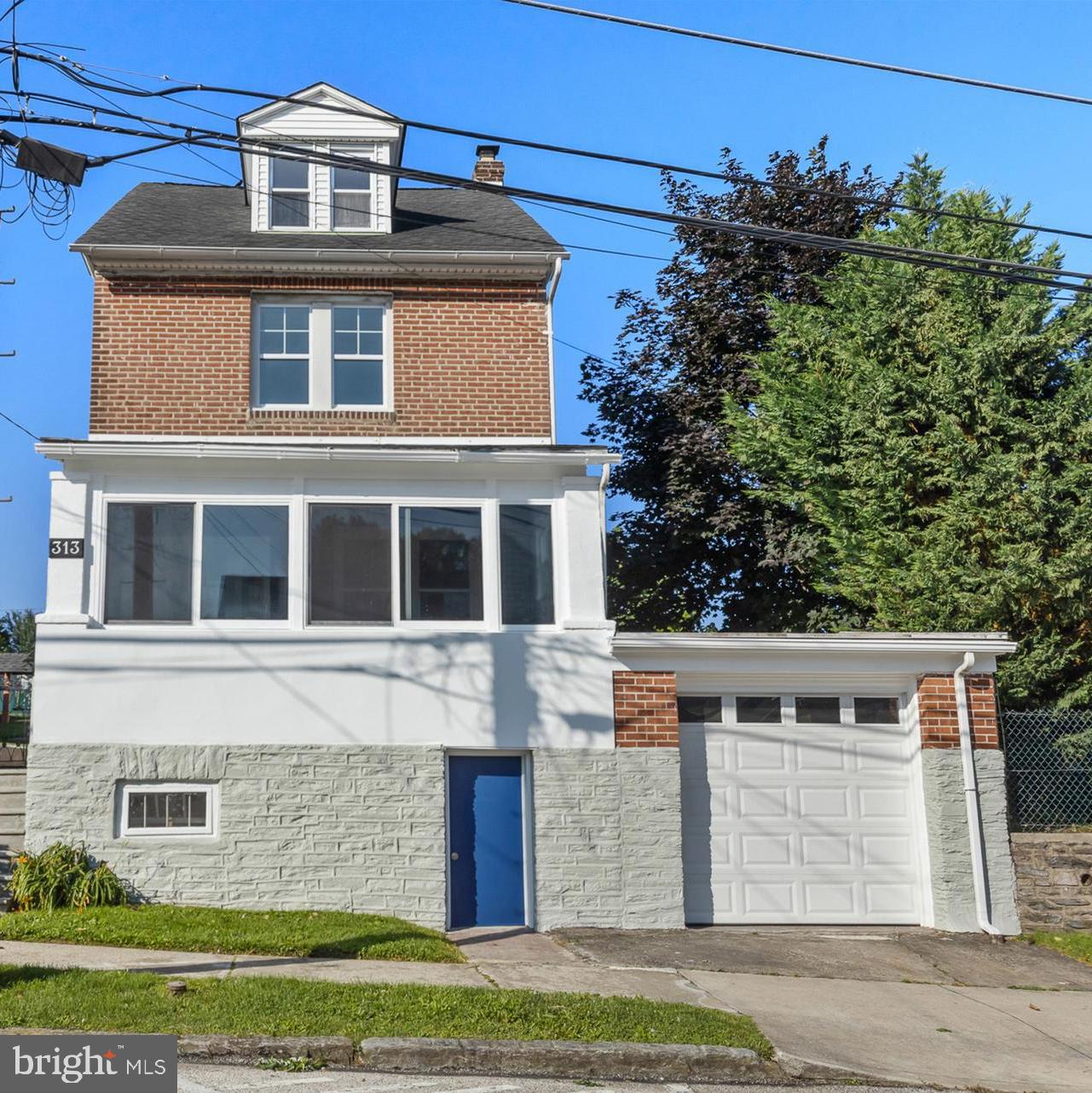 Welcome to this timeless 4-bedroom, 2 full-bath brick residence, nestled right in the heart of Conshohocken. Brimming with classic character, this home showcases original hardwood floors, ornate trim work, and thoughtful architectural details throughout. Comfort meets convenience with central air and two separate garages, offering ample space for parking, storage, or even a workshop.
The spacious kitchen is outfitted with beautiful custom cabinetry and flows into a convenient mudroom, perfect for daily living. The semi-finished basement includes direct access to one of the garages and even features a charming wine press—ideal for those who appreciate tradition and a touch of rustic charm.
Step out back and feel like you've been transported to Italy. A wooden pergola, draped in mature grapevines, shades the back patio and creates a serene, vine-covered retreat perfect for outdoor dining or relaxing with a glass of wine. Beyond the patio, the fenced yard opens to plush green grass, an adorable swing, and gorgeous established garden beds—your own private sanctuary in the borough.
This home is a rare blend of timeless elegance and everyday comfort, all in one of the most walkable and desirable neighborhoods in Conshohocken.
