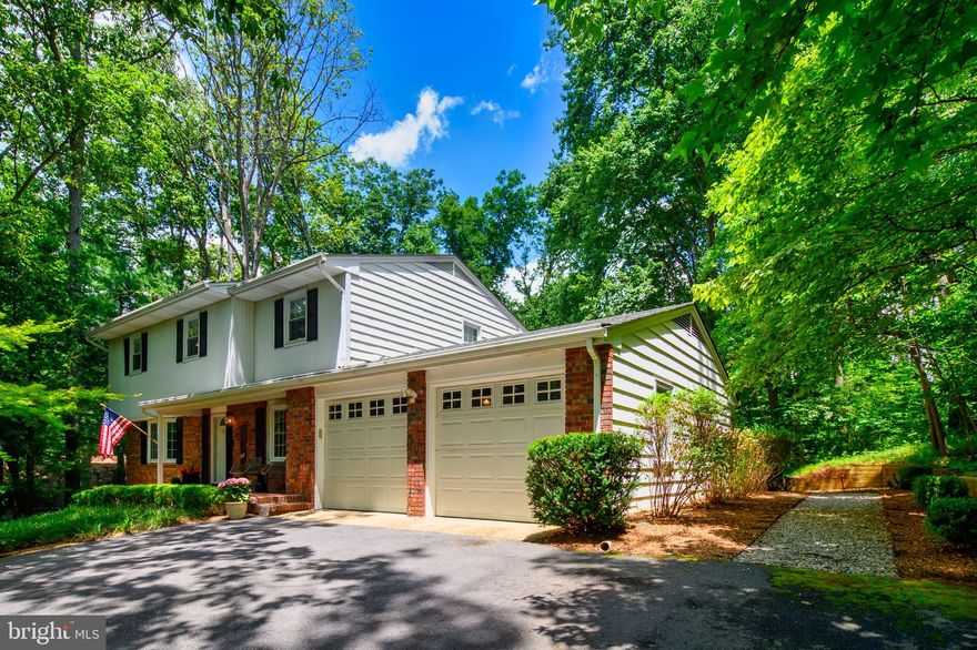 Welcome home to Baldwin Hills South!  This secluded gem offers a tranquil lifestyle on 1.38 wooded acres and is just minutes away from all the amenities you'll need.  In addition to 4 bedrooms and 2.5 baths, you'll love the hardwood floors throughout, newer roof, hvac and water treatment system.  Kitchen boasts lovely appliances, custom cabinetry and backsplash.  Check out the unusual pantry.  You'll also appreciate the formal living room with wood-burning fireplace and the separate dining room.  Relax in the family room that leads to a half bath, laundry and kitchen.  The piece-de-resistance is the large, screened three-season room with skylights & ceiling fans that afford a wonderful view of the private, park-like backyard.   Additionally, there is a patio offering built-in seating and a gas grill that remains.  An attached garage and large, unfinished basement complete the package.  Close to schools, houses of worship, shopping, and major commuting arteries.  Sellers offering a 1-year home warranty.