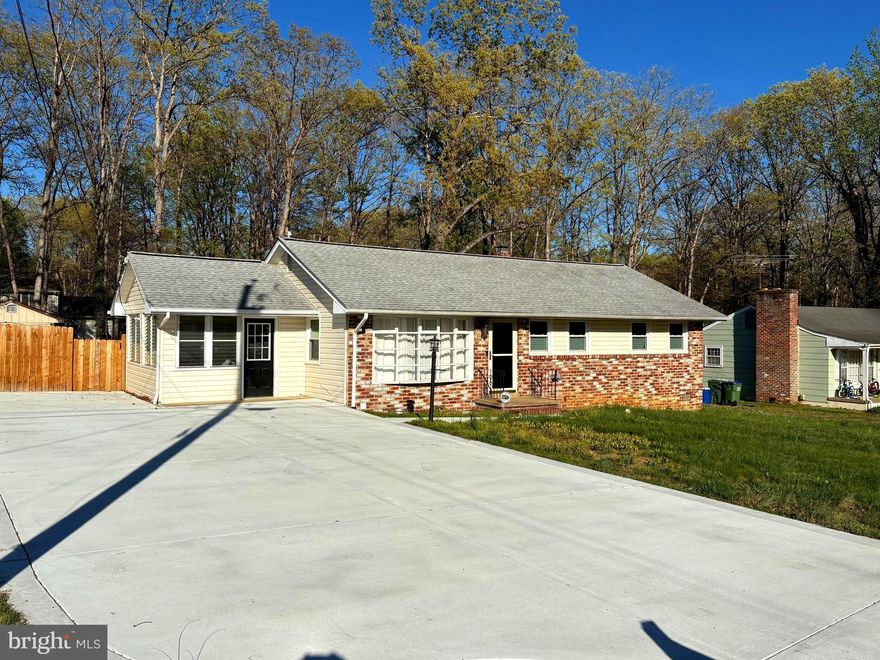 This 3 bedroom brick-front rambler (approximately 1,690 sq. ft. living space) is situated on a quiet cul-de-sac street with large fenced backyard, including 2 storage buildings (1 with electricity),  huge concrete driveway, new double pane windows.  This home is located near Ferry Farm Elementary School (3-minute walk).  FEATURES:  Family room with brick fireplace, living room, walk-up attic (pull-down steps), upgraded granite countertops and stainless steel appliances, freshly painted interior, wood flooring throughout (most rooms), newer HVAC and roof.  SPECIAL FEATURE:  Electrical system is setup for whole-house generator.