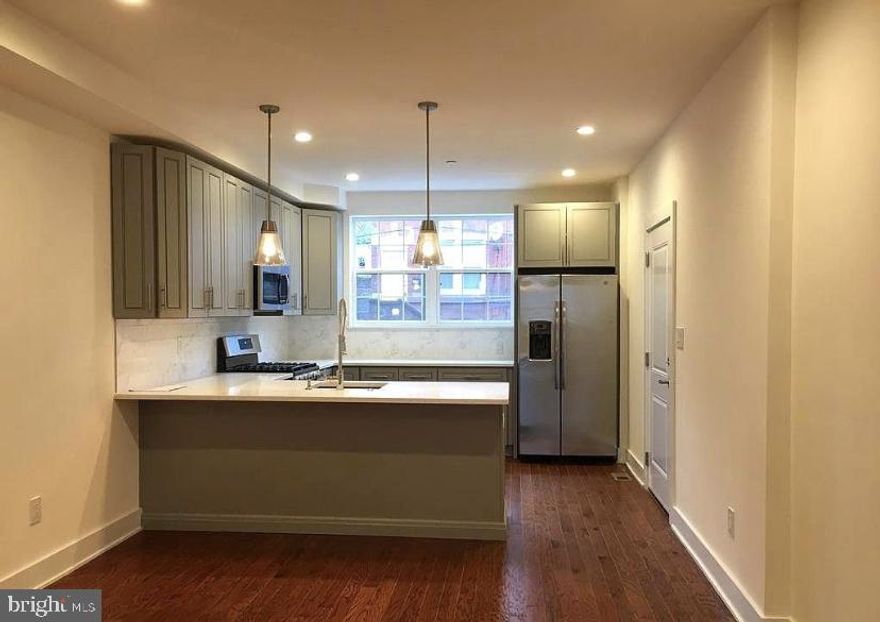 Newer construction (2019) wonderfully maintained by the owners. Private, gated PARKING right outside your back door! Upon entering the main level, you are welcomed by an open-concept living and dining area, that flows into a beautiful kitchen, with a large peninsula. There are large windows on either end letting in tons of natural light, custom blinds, and hardwood floors throughout. On the lower level, you will find two LARGE bedrooms with closets and two full bathrooms. Laundry closet on lower level with washer/dryer. Central A/C and heat throughout with Nest thermostat. Yale electric lock. Easy commute to HUP/CHOP/Penn and just a few blocks from Graduate Hospital, Point Breeze restaurants, yoga studio, and the library. Sorry, no pets. Owner covers water and HOA fees. Tenant covers electric and gas. No smoking.