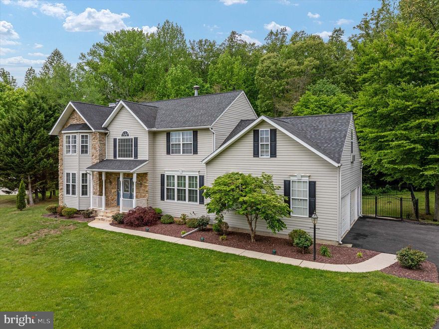 ***Professional pictures coming May 7th*** Nestled at the end of a quiet cul-de-sac in the highly desirable Beards Creek Estates community of Davidsonville, this exceptional 4-bedroom, 3.5-bath home offers over 5,100 square feet of thoughtfully designed living space on a private 2-acre lot. Spanning three finished levels, the home provides an ideal balance of comfort, functionality, and space for both everyday living and entertaining.
The open, light-filled main level features newly refinished hardwood floors and a welcoming family room centered around a cozy stacked-stone fireplace. The spacious kitchen is bathed in natural light and includes a large island along with serene views of the surrounding landscape. Just off the kitchen, a bright sunroom overlooks the expansive deck, hot tub, and designated space for outdoor dining. The main level is completed by a formal dining room, a laundry room, and a versatile living room with a bay window—perfect for a home office.
Upstairs, the generous primary suite offers a private retreat with an en suite bath featuring a soaking tub, separate shower, and dual vanities. Three additional bedrooms and a full hall bathroom provide ample space, including a large fourth bedroom above the garage that can easily serve as a playroom, hangout space, or guest retreat.
The walk-out lower level is designed for entertaining, with a pool table (can convey) direct access to the backyard and pool area, creating a seamless indoor-outdoor experience. With plenty of room for a recreation area, pool or ping pong table, and even a home theater, along with a full bathroom, this level offers incredible flexibility.
Step outside to your own backyard oasis, featuring a heated saltwater pool complete with a waterfall, diving board, and concrete surround—perfect for relaxing, sunbathing, hosting gatherings, or enjoying classic Maryland crab feasts. The expansive yard also includes a storage shed, a fire pit ideal for s’mores, and plenty of open space for pets, games, and entertaining, all set against a peaceful natural backdrop.
Enjoy the tranquility of a private retreat while remaining conveniently located for commuting to Washington, D.C., Baltimore, and Annapolis. This home truly offers the best of both worlds—come experience it for yourself. **Updates include - refinished hardwood floors (2026), replaced pool pump (2025), replaced water treatment system (2023), pool resurfacing (2021), deck (2018), roof, (2015),  fence (2013).  The conversion to a saltwater pool, primary bathroom and closet renovation, and 10 windows replaced in sunroom and kitchen (all within the past 10 years).  There is also a generator plug on the exterior of the house and the Seller is conveying the portable generator and storage bin**