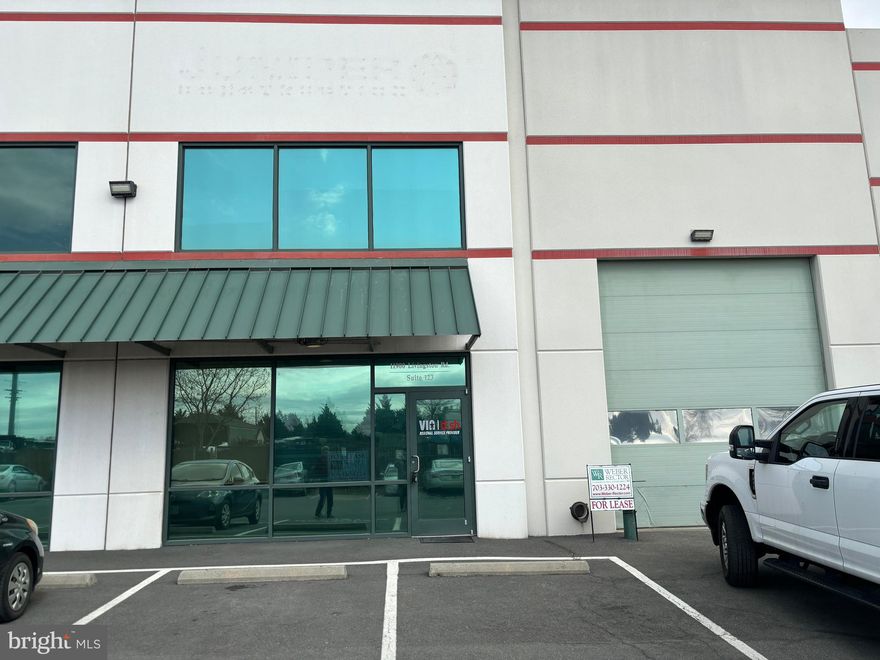 Heavy industrial office/warehouse unit with outdoor storage yard. Unit is 3,010 SF and consists of 3 offices, 2 bathrooms, 2 open areas, a kitchenette and 1 drive in door (12' x 14'). Reserved parking spaces plus private gated outdoor storage of 0.2102 AC (9,156 SF). M-1 zoning allows for many uses by-right including contractor/tradesman's shop, manufacturing, R&D and more. 
Currently leased through 7/31/27. Lease includes the option for a potential Purchaser to terminate with 90 days notice to Tenant upon sale of the property. Current rental income - $6,077/month NNN. Conveniently positioned unit with prominent visibility from Rt. 234 Bypass/Prince William Pkwy, boasting exposure to 39,000 vehicles daily! Accessible via Wellington Rd., with an additional 17,000 VPD. Just minutes away from Gainesville, Manassas, & Bristow, this prime location is nestled within a bustling industrial park and surrounded by fellow industrial users.
Tax records are for unit 123 only. Additional parcel 7596-39-6784.00
