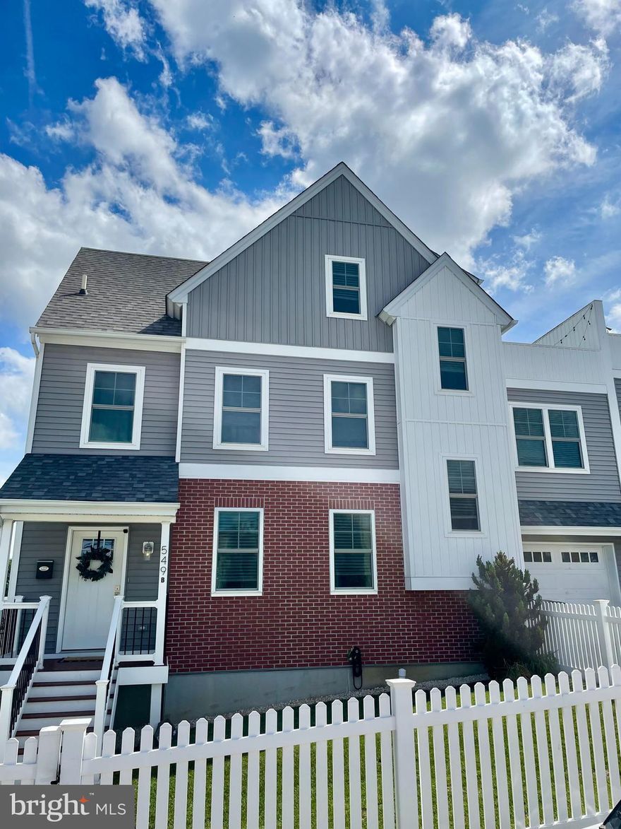 Welcome home to this beautiful, newer twin in Bridgeport. Get all of the perks of new construction without having to wait for building to be complete.  
Enter through the foyer into an open-floor main level filled with tons of natural light, dark wood flooring, composite deck off of the family room, and plenty of space to cook, eat & relax. This main level also includes access to the garage, access to the fully finished basement, and a bright half bathroom. This home is an entertainer’s dream! On the second floor, you will find 3 large bedrooms with huge walk-in closets. Storage is abundant throughout. This level also features a well-planned hall bath and convenient laundry room that boasts more cabinet storage. Climb the steps once more to the third level to find the primary suite which includes vaulted ceilings, a spa-inspired bathroom and sliding glass doors that open out to a roof deck. This level offers both luxury and privacy that is ideal for any home owner. Other details to note include the fenced-in yard, newer energy-efficient appliances, air filtration system, garage & driveway parking, and NO HOA FEES!! All of this is located in the highly-sought out Upper Merion School District.  Enjoy the walkability, new restaurants, shops, train, and proximity to the King of Prussia & the Conshohocken areas. Special Financing Incentives are available on this property from SIRVA Mortgage. Come check it out for yourself!
