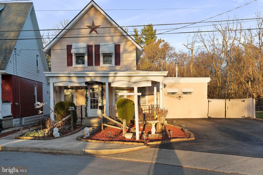 Main level features living room, dining room, family room and kitchen. Living room has carpeting, but hardwood floors underneath.  Dining room has hardwood floors and built-in cabinets. Family room is carpeted, has a wood stove and a closet for storage. Kitchen has laminate floor, closet/pantry, gas stove, and a portable dishwasher.  Off of kitchen in back there is a closed in back porch. Upper level has 2 bedrooms with laminate flooring and a full bath with tub/shower combo. Basement has laundry hookups, and plenty of storage area with some built-in shelves, and a door to outside.  Wrap around front porch. Backyard features a decorative pond and fenced yard.  Also has a large block 30x50 building with newer roof, concrete floor that you could park several cars in front to back, and a storage room in the back. Property backs to woods. Driveway entrance is shared with neighbor.  Convenient location, close to city park, mall, other shopping, restaurants, close to interstates.