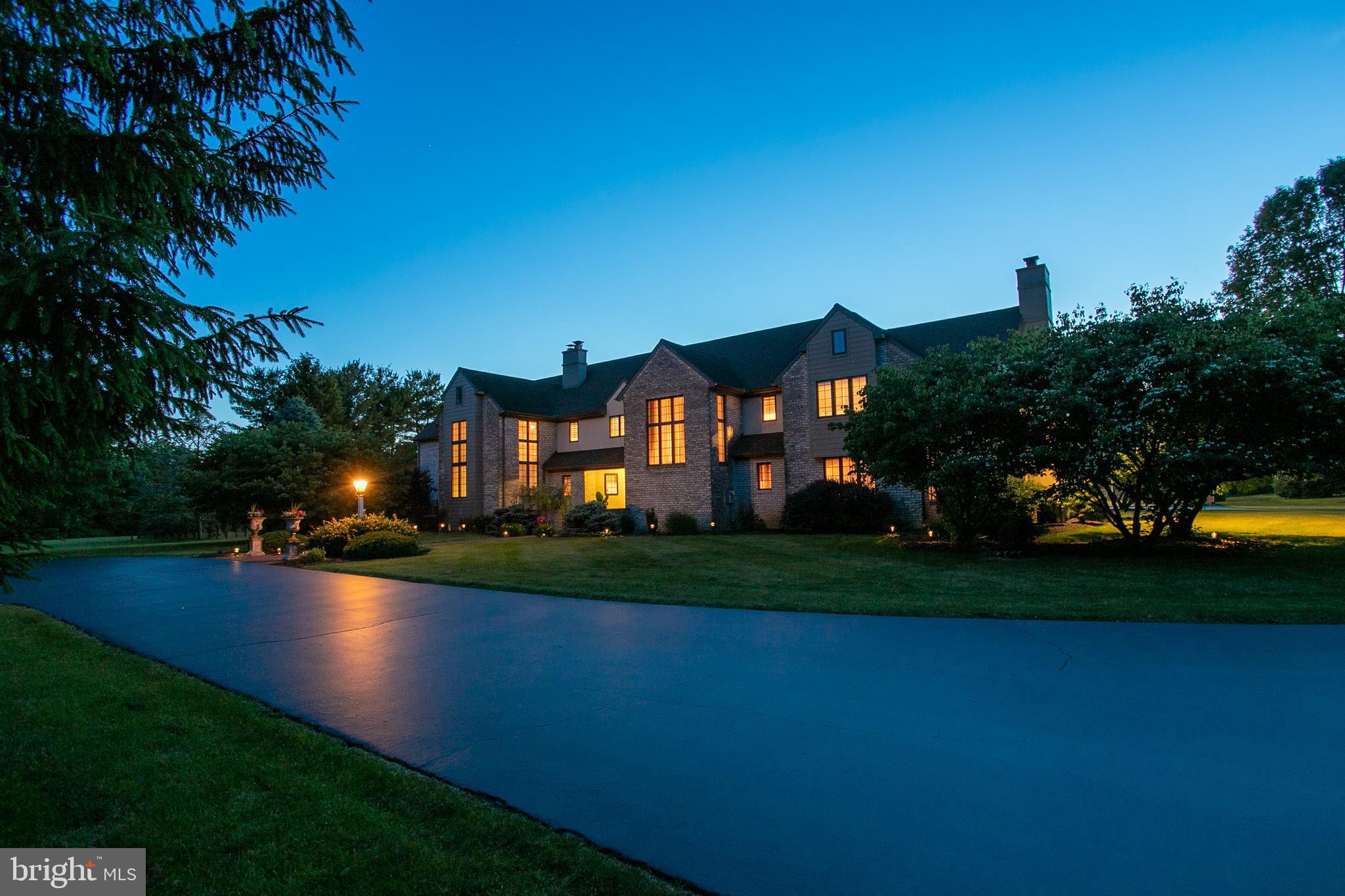 Located in the prestigious community of Stonehenge, this breathtaking property is a haven from the chaos of everyday life. The stunning yard which is entirely fenced boasts a luxurious in-ground pool, hot tub, and spacious patio for relaxing on warm summer days. Readily available is a pool house with a full bath and kitchenette as well. For tennis enthusiasts, there is a private, fenced-in tennis court with lighting for night time play, and a large gazebo for shade. The property also boasts a stall barn and plenty of space for equestrian activities--- all horses are welcome! Moving into the main house itself, this dazzling home features 5 bedrooms, 8 full, 2 half baths, and over 9,000 square feet of living space. The home is highlighted by an open floor plan, and showcases a beautifully lit sun room with access to the pool and patio area. For the cook in the family, the kitchen is a chef's dream with all stainless-steel appliances, a subzero fridge, granite island, double wall oven, gas cooktop, beverage fridge, endless cabinets, full walk-in pantry, distinct tile backsplash, and much more! There is also a charmingly designed living room with a gas fireplace and intricate mantel, crown molding, chair rail, and access to the side patio. Perfectly located off the living room is a wet bar with a wine fridge, built ins, and recessed lighting. When you walk up the stairs and find the stunning owner's suite, you'll find a haven for privacy and peacefulness. The owner's suite features a tall cathedral ceiling, a relaxing sitting area, spacious walk-in closets; plus 2 Full Private Baths, and a large steam shower. There are 4 additional bedrooms located on the second floor as well, 3 of which have access to their own full baths. Built for entertaining, the lower level is perfect as a game or media room. It boasts tile flooring, a half bath, and stairs leading to the main level office area as well as stairs to the foyer. A Kohler generator, reverse osmosis system, and water softener add to an already amazing home! While the home is secluded and peaceful, it is still convenient to local amenities, shopping, highways, airports, and much more. Gorgeous sunsets and everlasting memories await you at this luxurious property on Stonehenge Drive. Don't wait to see this home for yourself!