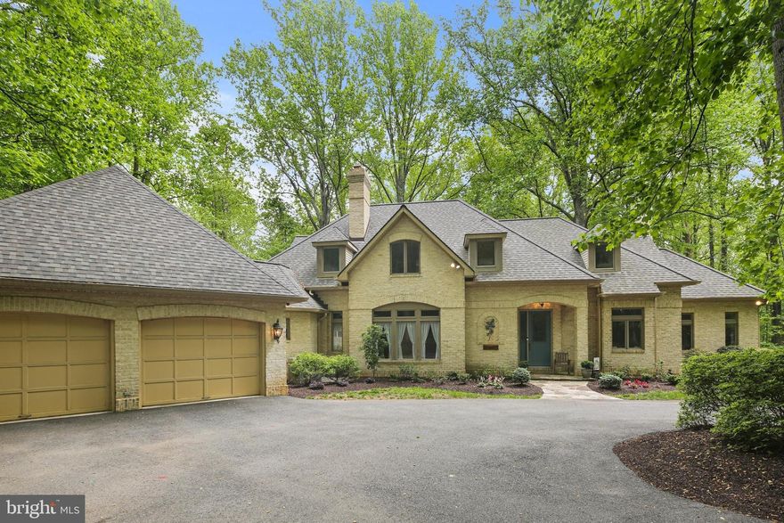 Welcome to this beautifully sited 3-en suite colonial on Mink Hollow Rd in Howard County close to the Montgomery County line.  You are immediately greeted with a long, private and circular drive taking you to this gorgeous brick-front home with exterior lighting nestled among 5 acres of privacy.  You have just the woods and trees to commune with (and a stream at the far back of the property), yet it is still part of a desirable Highland community.  As you enter, you will be greeted by a wall of atrium windows providing a full-view of the forest.  The main floor boasts three family rooms (one with brick fireplace) and right off the kitchen, two offices/dens (one with a marble fireplace), a huge gourmet kitchen with island and stainless steel appliances and views to eat and admire the scenery, a large laundry room complete with cabinets and a sink and two powder rooms.  There is also a large screened porch off the kitchen and a two-tiered deck to entertain and enjoy the outdoors.  Upstairs you will find three over-sized bedrooms, each complete with its own full bathroom, beautiful windows, and walk-in closets, and a laundry chute and ceiling fan in the primary.  The lower level has a stately brick fireplace and has been partially completed but is truly ready for your finishing touches.  There are French doors to the outside from the LL.  Come check out this gorgeous custom-built home, with hardwood floors throughout the first level and stairs, tons of natural light, spacious two-car garage , and magnificent drive with ample parking for large events.  With proximity to two counties, it is the perfect location, close to restaurants, shopping, and major arteries.  Roof new in 2021 (and new attic insulation installed 6 months ago), kitchen appliances new in 2021, W/D new in 2023, all systems regularly maintained (septic pumped in Dec 2024, Terminix comes monthly, gutters maintained, well checked regularly).  Water neutralizer in place including water expediter.  Check out this spectacular home today!