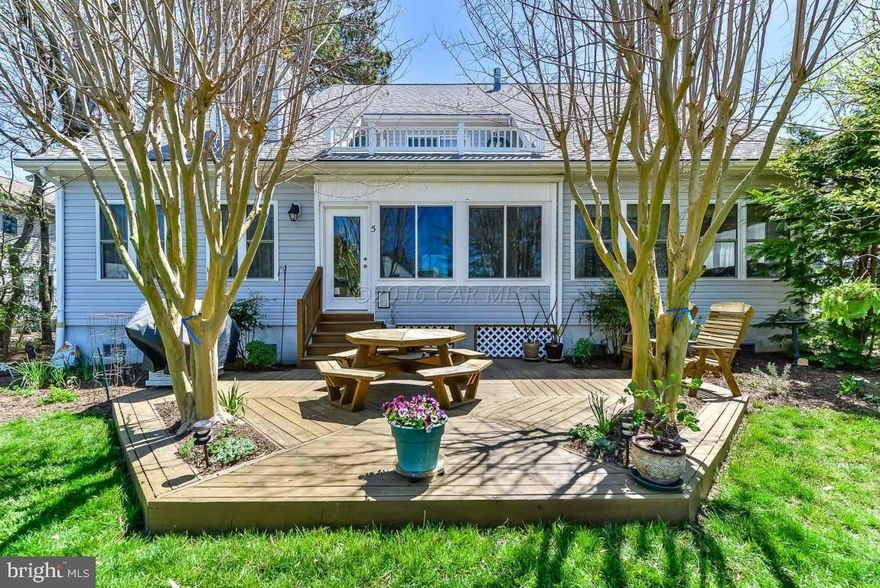 Located in the exclusive waterfront community of Harbor Village located in Ocean Pines.  Drive up to a beautiful home with aggregate driveway, custom landscaping and a front porch that is as welcoming as a bright summer day.  Exceptional features such as a private entry to the 2nd floor, upgraded wiring, central vacuum and a well appointed greenhouse. There is a 3 car garage! (insulated and finished)  The separate utility and laundry rooms each have a utility sinks. There is fresh water and power to the dock. Easy- first floor living and on the second floor you will see two lovely loft areas, three bedrooms and the sweetest private deck overlooking the canal