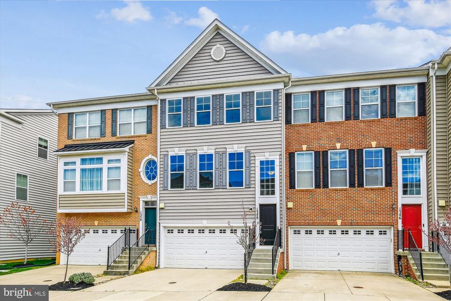 Spacious Townhome in the Heart of Waugh Chapel Centre!  Freshly painted throughout with brand-new ​carpet and LVP flooring!  This stunning townhome is just steps from shopping, movies, and restaurants, with easy access to military bases and major routes ​(295/97/301).  Featuring three beautifully finished levels, the main floor boasts gorgeous ​luxury vinyl plank flooring in the open-concept living and dining area. The gourmet kitchen is a chef’s dream, complete with stainless steel appliances, granite countertops, and ample cabinetry. Adjacent to the kitchen, the cozy family room features a gas fireplace, perfect for relaxing evenings. Step outside onto the spacious, maintenance-free deck backing to woods to enjoy outdoor entertaining.  Upstairs, the primary suite impresses with cathedral ceilings, a walk-in closet, and a luxurious en-suite bath featuring custom tile, a soaking tub, a separate shower, and dual sinks. Two additional spacious bedrooms and a full bath complete the upper level.  The entry-level welcomes you with a two-story foyer. This level also features a ​spacious rec room with walkout access to the inviting backyard patio and fenced-in rear yard. The two-car garage with a private driveway provides ample parking.  A fantastic opportunity to own a move-in ready townhome in a prime location!  Check out tour and floor plans!