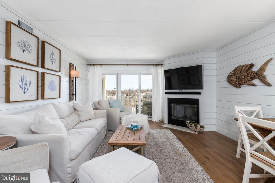 Welcome to this extraordinary oceanfront retreat, where luxury meets the beauty of nature! Nestled along the pristine coastline, this completely renovated 3-bedroom, 2-bath condo offers views of the beach and ocean at every turn. Step inside to discover an open, light-filled main living area featuring exquisite shiplap accents, open concept and wood burning fireplace. The kitchen is outfitted with high-end finishes, designed to inspire while enjoying the captivating views. Custom cabinetry are complemented by a large bar that opens to the living room—ideal for entertaining. The master suite is a true sanctuary with a marble-tiled stand-up shower in the en-suite bath, where you can unwind while listening to the sounds of the ocean. Step out onto one of two private balconies to catch the early morning sunrise, or relax in the evenings. This condo is designed with family and guests in mind, featuring four built-in queen-sized bunk beds, making it the perfect beach getaway for friends and family to come together. This is more than just a home—it's a lifestyle. Don't miss out on the chance to own a piece of paradise with spectacular ocean views and an unmatched beachside location.