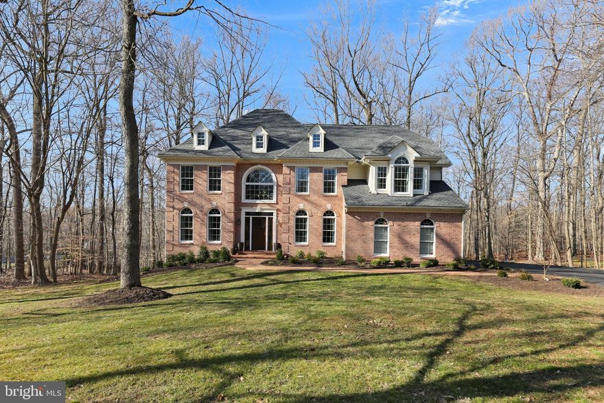 Spectacular 6 bedroom, 4 bath Glenangus estate on a private .94 acre homesite! This custom built home features a two story foyer with front and back stairs with wood and wrought iron rails. Separate living room and dining room. Two story family room with wall of windows, hardwood floors and double sided gas fireplace to kitchen. New gourmet kitchen with two tone cabinets, 10 foot island with quartz counters and seating for five, stainless steel appliances, and planning desk. Full bath and bedroom/office on entry level. Gorgeous primary bedroom with vaulted ceilings, gas fireplace, seating area an walk-in closet. Fully finished lower level with bedroom, full bath, family room and exercise room with walk out. New roof 2022, electric dog fence 2020, carpet replace throughout 2019. Composite deck with screened in porch overlooking the woods!