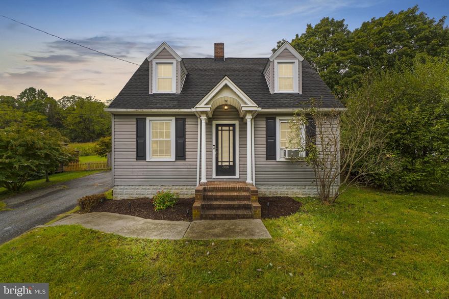 Welcome to 346 Ridge Road! This gorgeous home is quaint and just perfect, with true character and modern updates throughout! Pull into the large driveway, and you are met with an aesthetically pleasing home nestled on a gorgeous lot. Step in from the covered front porch and find a welcoming family room with a brick fireplace and mantel! Gleaming hardwood floors extend through the dining room! Crown Molding! Arched doorways! Updated windows which offer a ton of natural light throughout! Beautiful custom gourmet kitchen with white cabinets, tons of storage space, glass front cabinets, granite counters, ceramic tile floor, stainless steel appliances, and a custom backsplash. The sunroom is off the kitchen and is the perfect space to relax at the end of a long day or entertain your family and friends! This leads to the lovely rear yard that is large and flat!  Upstairs, the hardwoods continue and you will find the primary suite, an additional bedroom, and a fully updated bath!  The basement is finished and offers a rec room (with an exposed industrial ceiling), a custom bar, laundry, and tons of storage! The home also offers a one-car detached garage! This property will not last long. NO HOA! '24 Oil Tank!  Schedule your showing today!