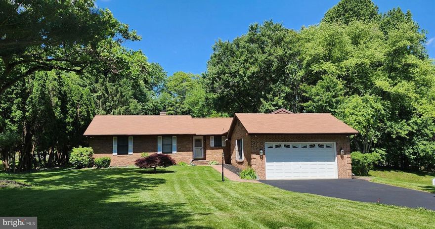 SOLD! We can sell yours too! One of the larger ranchers in Eldersburg and NO HOA! Total 3,000 plus finished Sq Ft . A premier flat lot, spanning over 0.57 acres,is nestled in the serene enclave of Freedom Forest. This exquisite ranch-style residence offers a harmonious blend of comfort and elegance. 3 bedrooms, 2 full and one half bath on main floor, and on the lower level a remaining bedroom, currently used as a game room, plus the 2nd half bath. If you are looking for one level living, and do not want to give up entertaining space this is the home you need. Spacious and bright kitchen with new quartz counters, leads to a large sunroom, currently used as a gym, has ceramic tile under the cushioned gym floor panels. Enjoy your morning drink or lunch on the quaint porch off of kitchen. The laundry room is also located on main floor.  Large living room with wood burning fireplace and dining room can accommodate large gatherings and leads to a spacious deck and rear fenced yard. Many soccer goals have been scored here! The expansive lower level adds to entertainment area and still a large area for storage. The 2 car garage has been enjoyed by "Clifford" the Big Red Truck and happily awaits your new vehicles to keep safe and dry. Parking is a breeze with a front-entry attached garage that accommodates two vehicles, along with a paved driveway offering additional space for guests. The cul-de-sac location ensures minimal traffic, enhancing the peaceful ambiance of this exclusive neighborhood.. New Roof, New AC, New Quartz Counter in Kitchen, Hot Water heater, Carpet on lower level and first bedroom, Replace low drop ceiling on LL with Drywall ceiling for more height, LL Half bath updated!