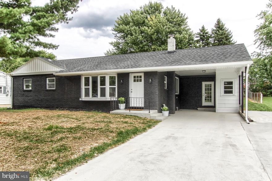 So much to appreciate in this newly updated home which has been completely renovated and is located in the Cumberland Valley School District.  Take time to reflect in the serenity of the primary living room. The newly update kitchen offers white cabinets, granite countertops with tile backsplash, an island with seating, and includes a new stove, microwave and dishwasher. A powder room is located adjacent to the kitchen. Entertain family and friends in the formal dining room enhanced with wainscoting. The family room is graced with a brick wall which hosts a fireplace for those chilly winter nights.  Exposed beams add an element of additional charm!    Enjoy your morning coffee or afternoon tea in the enclosed sunroom just off the kitchen.  Easy care laminate flooring has been installed in the main living area.  The balance of the home offers 3 bedrooms and 2 full baths.  Plush carpeting has been installed in each of the bedrooms.  The bathrooms all offer tile flooring along with new sinks, shower or tub and faucets.  New light fixtures have been mounted throughout the home.  Be sure to take a look at this new listing!