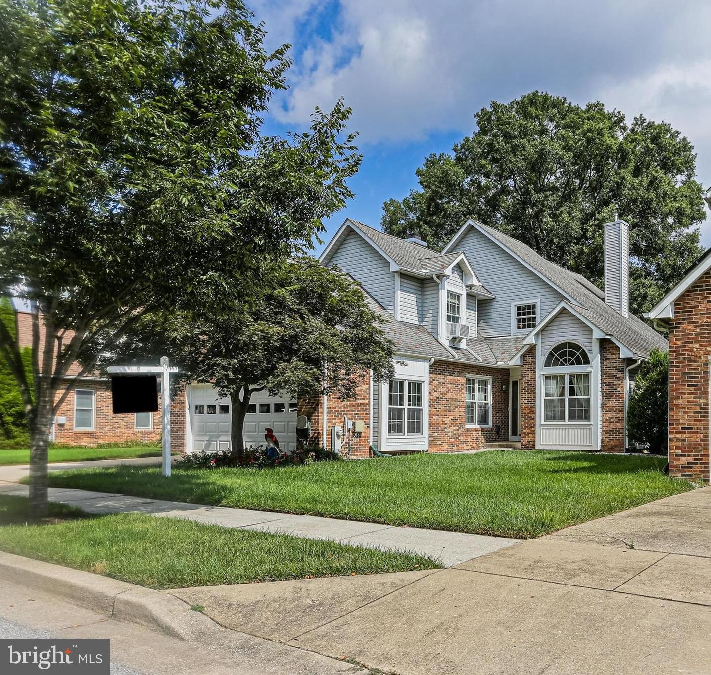 Welcome to 14113 Greenview Drive, a charming and meticulously maintained 3-bedroom, and 2.5-bath home nestled in Laurel, MD. This home features a spacious and light-filled layout with vaulted ceilings, skylights, and a two-story great room. The main level boasts a cozy den with a wood-burning fireplace, a formal dining room, and a beautifully updated kitchen with tile floors and stainless steel appliances, opening to a bright eat-in area with a bay window. The two-story great room features a 3-year-old pellet stove with direct access to the rear deck, which boasts Trex decking and a hot tub—perfect for outdoor entertaining. The main level primary suite offers vaulted ceilings, deck access, and an updated en-suite bath with a soaking tub, walk-in shower, dual vanities, water closet, and large walk-in closet. Upstairs, two additional bedrooms feature skylights and share a Jack-and-Jill bath with a tub/shower combo. Additional highlights include a half bath, laundry room on the main level, underground sprinkler system for the front yard, Custom sidewalk from front door to rear deck, mostly Pella windows, fresh paint in the garage, kitchen, dining room, and den. Perfectly situated in Laurel with close access to local dining, shopping, and so much more! Don't miss!