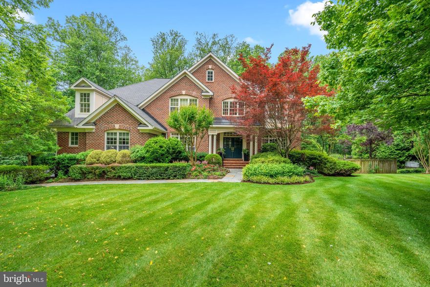 This is a home that isn’t afraid to be different. Tucked inside the sought-after Deep Glen Estates, an unexpected enclave of custom homes, this 6-bedroom, 7-bath custom estate sits on 1.5+ private acres backing to trees, offering over 7,000 square feet of living space designed for both entertaining and everyday comfort.

What makes this home stand out is its use of color. In a world of beige and gray interiors, each room in this home has its own rich palette — vibrant, inviting, and full of life. It’s a home that feels happy, and buyers looking for something with personality will appreciate its warmth and character.

Inside, the two-story foyer and family room with 17-foot ceilings create an airy, open feel. The updated kitchen is a showpiece, with custom cabinetry, a farm sink, warming drawer, oversized Thermador fridge and freezer, built-in espresso station, and a statement-making La Cornue gas range with custom hood.

The main level also includes formal living and dining rooms, a private office, laundry room, and two powder rooms conveniently located.

The walk-out lower level is built for entertaining — with a wet bar, huge rec  room  space with a pull-down screen (perfect for movie/game night), two guest bedrooms (or flex spaces), two full baths, a cedar closet, and plenty of storage.

Out back, the private yard is a true retreat with a pool, waterfall, hot tub, lush gardens, and quiet spots to relax or host a gathering.

Convenient to Great Falls Village, McLean, Tysons, Reston, and major commuter routes, this home offers the perfect mix of privacy, character, and accessibility.  Bonus:  Public water and sewer