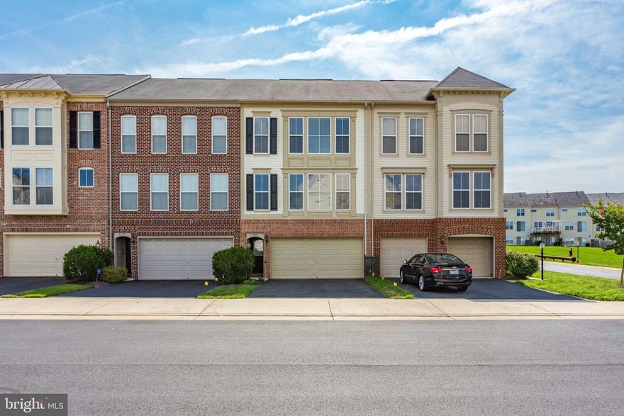 Beautiful, spacious townhouse with hardwood flooring, ceramic tile flooring and carpet.  Large kitchen with SS appliances, granite island and plenty of counter space. Open family room and dining room. Sliding glass door to deck off family room. Spacious master bedroom with 2 walk-in closets, master bath with separate soaking tub and double vanity.  Finished basement with sliding glass door to fully fenced back yard. Two-car garage with storage space.