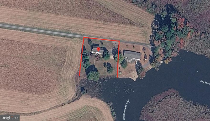 Nearly one acre of waterfront-adjacent land on the Little Blackwater River — with federally protected land as your permanent rear boundary and Blackwater National Wildlife Refuge just minutes down the road.

This is a builder's opportunity. The existing structure is a tear-down, priced accordingly. What you're buying is the lot — a private, river-backing acre in one of the most scenic corridors on Maryland's Eastern Shore, surrounded by open fields and protected land on three sides with one neighboring property to the east.

The location speaks for itself. Egypt Road is the primary access route into Blackwater NWR, one of the most visited natural destinations on the East Coast. Serious nature tourism, hunting, fishing, kayaking, and wildlife photography draw visitors to this corridor year-round. For an investor or developer with vision, the demand is already here.

Custom retreat. Private residence. Nature-focused short-term rental. The use case is yours to define.

Priced at $275,000. Contact us today to schedule a showing.