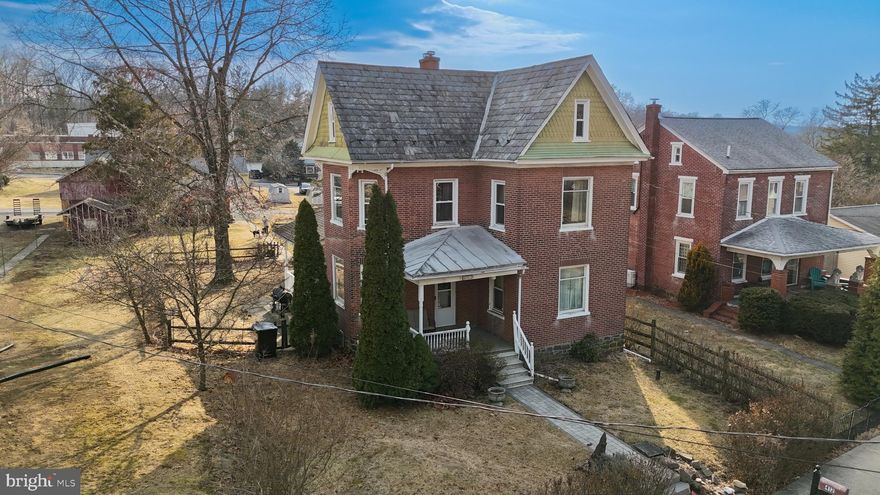 Welcome to this charming Victorian Detached Home with a fenced in yard and quiet small village setting.  The first floor has plenty of practical space and tons of charm consisting of a living room, dining room with a bay window, a den/family room, and a convenient powder room. The large kitchen features oak cabinets, and stainless steel appliances including a JennAir propane range with an electric oven. The kitchen also has a walk-in pantry with an etched glass door. The second floor features three bedrooms, one with a bay window, and a hall bath. The 3rd bedroom is a bit small but plenty room in the attic for a 3rd or 4th full-sized bedroom.  Enjoy the outdoors from the front porch or the side porch overlooking the oversized shady yard. Brand new Oil Boiler and Public Gas is available on the street. The two car garage/shed and the three car driveway are accessed from a rear public alley. Schedule a showing today.