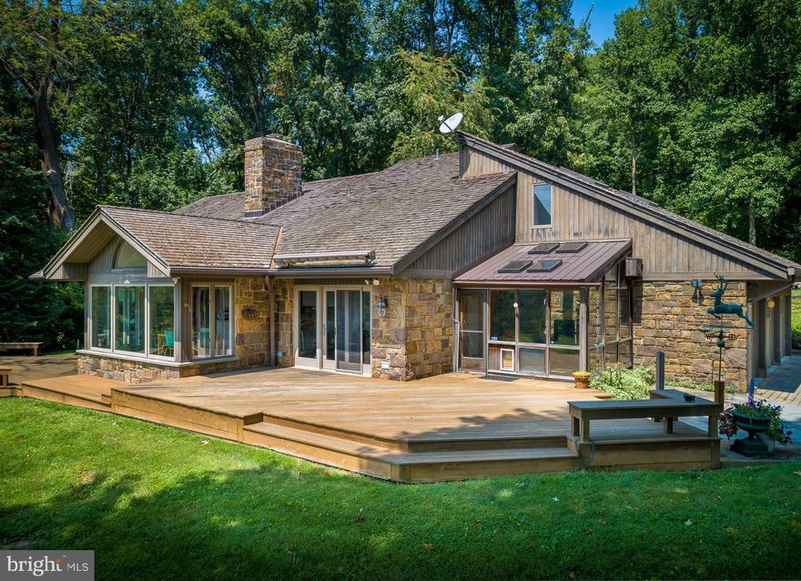 Set on 19 private acres and situated high on a hill, this property delivers one of the best views in Chester County. It is also surrounded by hundreds of acres of preserved land, making this a rare opportunity for a buyer who values peace and quiet. The not-far-off-the-beaten-path location is an excellent balance of bucolic setting and convenience, with schools, parks, shopping centers, and major highways all easily accessible. The vibrant downtown of Phoenixville is just 12 minutes away. This well-maintained property offers a comfortable and inviting living space, perfect for families or individuals looking for a peaceful retreat. 

Upon entering the home, you are greeted by a spacious and bright living room, featuring large windows that allow natural light to flood the space and help to showcase the impressive hillside views. The open floor plan seamlessly connects the living room to the adjacent dining area, creating an ideal space for entertaining guests or enjoying family meals. 

The kitchen is a chef's dream, boasting modern appliances, ample cabinet space, and a convenient breakfast bar. With its sleek design and functional layout, this kitchen is sure to inspire culinary creativity.

The home offers three generously sized bedrooms, each providing a peaceful sanctuary for rest and relaxation. The main floor primary bedroom features an en-suite bathroom, providing privacy and convenience. The additional bedrooms share a well-appointed full bathroom.

The outdoor space is equally impressive, with a spacious backyard that offers endless possibilities for outdoor activities and gatherings. Whether you prefer to relax on the patio, tend to a garden, or create a play area for children, this backyard provides the perfect canvas for your imagination. A tennis court adds more recreational fun.

Additional features of this property include a three car garage, providing ample storage space, and a laundry room for added convenience.  A custom detached studio / guest house with a powder room provides additional flexible space for an office, artist, hobbies, exercise, etc. Do not miss out on a chance to make this beautiful property your new home!