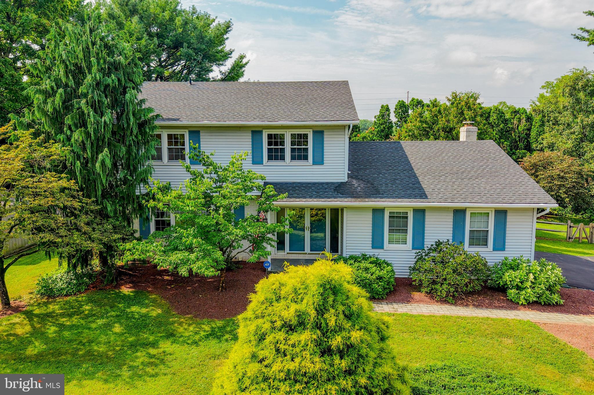 Nestled in the sought-after Shepherd Hills community, this spacious colonial home offers an unbeatable location right along the golf course. Enjoy a well manicured and fenced-in backyard while basking in the natural light that fills every room. Designed for both comfort and style, this home features large room sizes, an airy layout perfect for everyday living and entertaining. Hardwood floors throughout the first and second floors. Open concept living room and dining room boast a large picture window, neutral paint and glass slider to the rear covered patio and deck. Eat-In kitchen with solid wood cabinets, plenty of counter and cabinet space. Convenient first floor laundry. Washer, Dryer and Refrigerator are included. Cozy family room with wood burning fireplace and glass slider to the rear deck with electric awning. Finished basement with an additional recreation/flex space and storage room. Second floor primary bedroom boasts two double closets, on suite full bath with shower and glass sliders to the balcony. Three more additional bedrooms and another full hall bath complete this well maintained home. Updated roof & windows throughout. Two zone central air. Prime location—just minutes from shopping, dining, and major commuter routes, yet tucked away in a peaceful, scenic setting. A rare opportunity to enjoy golf course living in the heart of Lower Macungie.