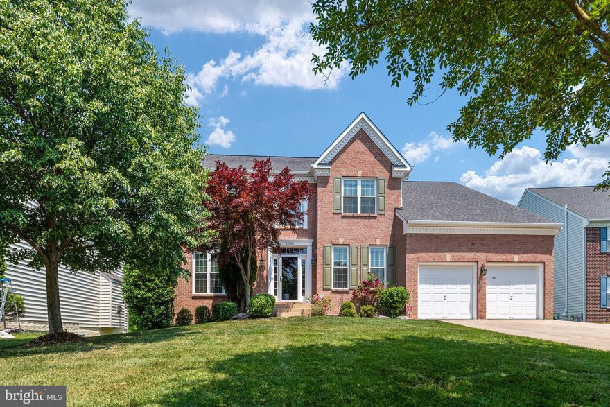 Your search is over! This beautiful colonial home is meticulously maintained and is in turnkey condition - ready for you to call home! Four bedrooms and 3.5 baths in this brick front home with a well-manicured lawn with sprinkler system! As you enter the foyer gleaming hardwood floors standout in the spacious two-story space with an elegant chandelier matching the wrought iron spindles in the staircase.  High ceilings and crown molding throughout with tasteful millwork highlight the architectural details of the home. New Sunrise double pane windows from Beldon Windows on the front of the home and primary bedroom and bathroom with lifetime warranty. Roof was replaced in 2018 and lower-level HVAC replaced in 2017. Custom blinds throughout the house. The gourmet kitchen is open concept and beautifully appointed with updated cabinetry, stainless steel appliances including new double ovens (2020), pantry, hardwood floors and desk space. Double stainless sink with touchless faucet for your convenience. You will love entertaining friends and preparing meals in this space.  French doors lead out to the large deck with built in seating and flower boxes and stairs leading down to the back yard. Step down from the kitchen eating area into the family room with gas fireplace for cozy times by the fire.  There is a private office on the main level with French doors at the entrance with lots of natural light from the large window. Enjoy the separate Living Room and Dining Room. The formal Dining Room is an elegant space with crown, chair rail moldings, wainscoting and decorative columns.   Upstairs you can retreat to the spacious owner's suite featuring a vaulted ceiling and sitting area defined by a custom column surround. The owner’s bath has a corner soaking tub and a spacious shower and water closet. Two large walk-in closets complete the suite. Down the hall is the laundry room with washer/dryer hookup, a separate sink and linen closet. Three well sized bedrooms complete the upper level.  On the lower level is a spacious, finished recreation room with 9 ft ceilings.  Extra large space for fun, games, or guests. Large storage area and lots of closet space. Full bathroom with tub shower and tile flooring. Double door walk-up exit from the basement to a nice backyard. 2 car garage and long driveway to accommodate guests or additional vehicles.  Close to shopping, restaurants and grocery stores.   Military Facilities w/in 25 miles: Andrews AFB (16 mi.), Annapolis Naval Academy (19 mi.), Bolling AFB (25 mi.), Fort Meade (22 mi.), Pentagon (25 mi.) ALL MILEAGES ARE APPROXIMATES.