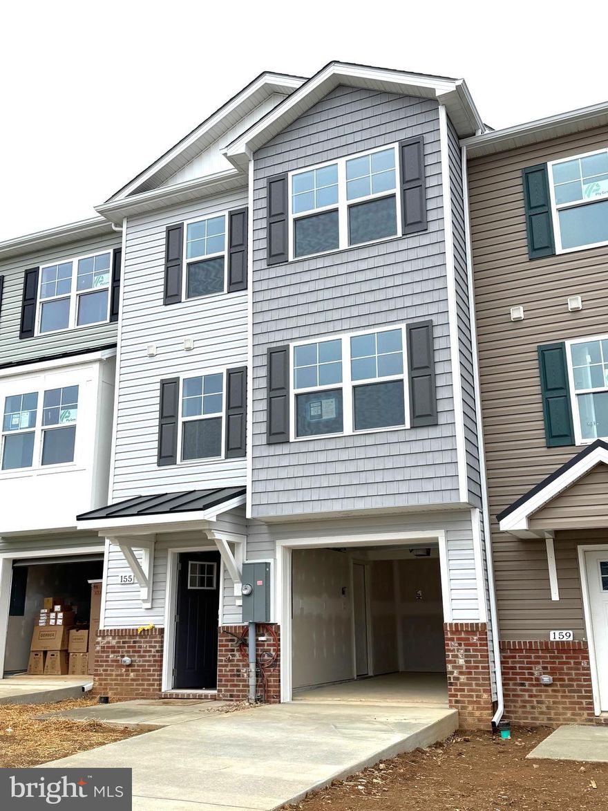 Brand New Townhomes in The Communities of Burwell! The difference is in the details — and they’re all included!  Discover the perfect blend of comfort, style, and convenience in these beautiful new townhomes offering 1,915 sq. ft. of thoughtfully designed living space. The open main level welcomes you with luxury vinyl plank flooring, a spacious family room extension, and a stunning kitchen featuring granite countertops, stainless steel appliances, and a large island with bar seating—ideal for entertaining or everyday living. Upstairs, the impressive primary suite showcases vaulted ceilings, a generous walk-in closet, and a spa-inspired bath with a tile shower and glass door. Two additional upstairs bedrooms provide plenty of space for family, guests, or a home office. The finished lower level includes a fourth bedroom and full bath, offering flexible options for your lifestyle. A brick-accented exterior,  10x12 rear deck, 1-car garage with opener, and concrete driveway complete the package—enhanced by ample overflow parking just steps away for added convenience. Ideally situated just minutes from I-81, shopping, grocery stores, and popular restaurants, The Communities of Burwell offers both modern living and everyday ease.  Photos are of similar construction.