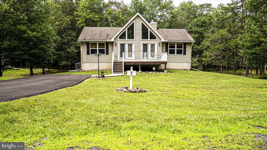 Property under contract - showings for back up offers only.  Meticulous! Great Get Away or Primary home. Located close to the lake in amenity filled Indian Mountain Lakes community. Primary bedroom and bath on one side of the open Living area and kitchen and two more bedrooms and main bath on the other side. Full walkout basement is a blank canvas for you to finish to meet your needs. It is already plumbed for another bathroom. Laundry hook up, water system, hot water tank, electrical, and generator panel all downstairs. Other features are central air, whole house generator, trex deck, blacktop driveway, 1250 gallon septic tank, Association green space behind your property, dead end street. Showings confirmed with real pre-approval or proof of funds. Square footage from public records. Make your appointment, listing agent must be present.