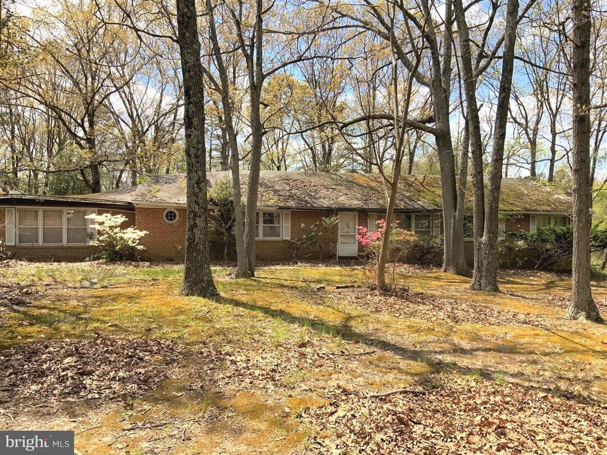 ATTENTION INVESTORS- rehab or rebuild opportunity in the beautiful water-oriented community of Sylvan View on the Magothy! Roof has collapsed on one side. One level living, huge full brick rambler (almost 3,000 sqft of living space), 4 bedrooms 2 bathrooms on over an acre of land with relaxing river views. Minutes from community amenities like the marina, community beach with dock slip access, playground, picnic area, and community piers.