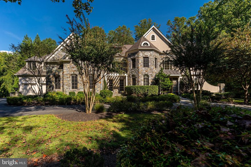 NEW PRICE! Nestled on a serene and private 3-acre lot, Saunders Court is a stunning custom home that boasts unparalleled quality and detail including an elevator & generator.  With over 10,000 square feet of living space on three levels, the home offers a flexible floorplan perfect for both informal and formal entertaining. 

As you step into the grand two-story foyer, you are greeted by the curved walnut staircase and high ceilings that set the tone for the rest of the home. The embassy-sized dining room and two-story walnut-paneled conservatory are just a few of the impressive features that make this home one-of-a-kind. The wine grotto and bar area are perfect for hosting tasting parties, while the gourmet chef's kitchen with a large walk-in pantry and top-of-the-line professional appliances will satisfy any cook.

With seven private bedroom suites, including a luxurious primary suite, and three powder rooms, everyone will have their own space to relax. The walk-out lower level offers a home theater, billiard area, fully outfitted bar and cafe, gym, recreation area, game room and abundant storage space. The sport court, two 2-car garages with an electric charger, and central vacuum system add convenience and comfort to the already impressive list of features.

Conveniently located  with easy access to downtown Bethesda, DC or NOVA and close to Great Falls National Park. Whitman School Cluster. With no HOA fees, this magnificent home truly offers the best of both worlds.