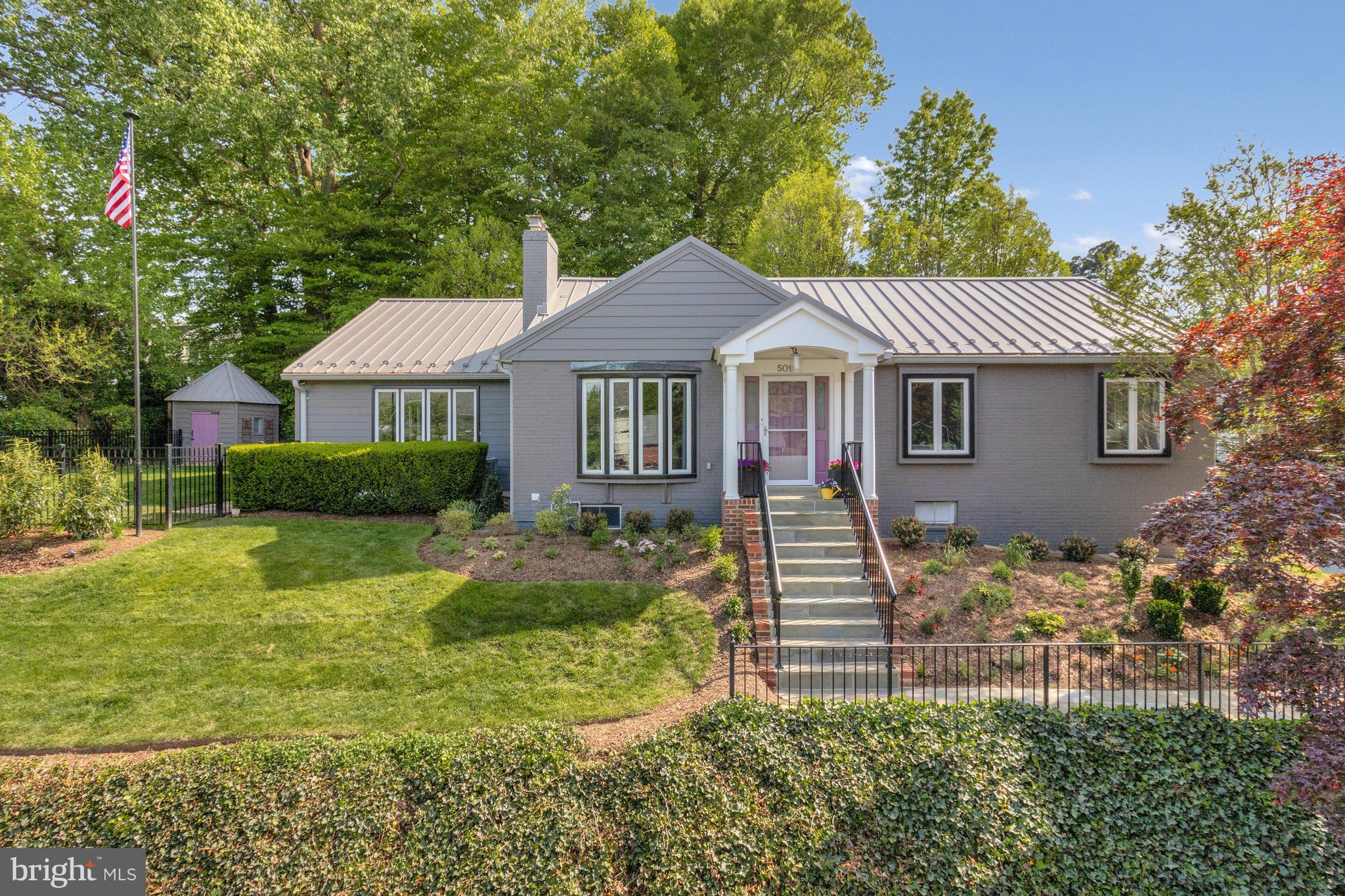 Situated on a beautifully landscaped lot in North Arlington’s sought-after Country Club Manor neighborhood, this spacious 4-bedroom, 3-bath home has nearly 2,800 sq ft of living space on 2 levels and a 1-car, side load garage, with ample additional street parking. Features include an open floor plan with hardwood floors, large family/dining room addition with vaulted ceilings, and tons of oversized windows, maximizing the natural light and creating a seamless flow throughout the main level. The renovated eat-in kitchen features Wi-Fi-enabled appliances - including a smart refrigerator, oven (with induction cooktop), and even a smart faucet, plenty of storage and direct access to the deck. The stove was converted to electric, with an induction cook-top, but can be easily converted back to gas.
The finished lower level offers flexibility and convenience with a private bedroom, full bath, large laundry room, and pantry for extra storage. Enjoy outdoor activities and relaxation with an expansive deck, extensive hardscaping, established landscaping and plenty of space to play and let pets explore, with the usable, fenced-in side yard. Public water and sewer. Easy access to GW Parkway, DC and downtown Arlington.