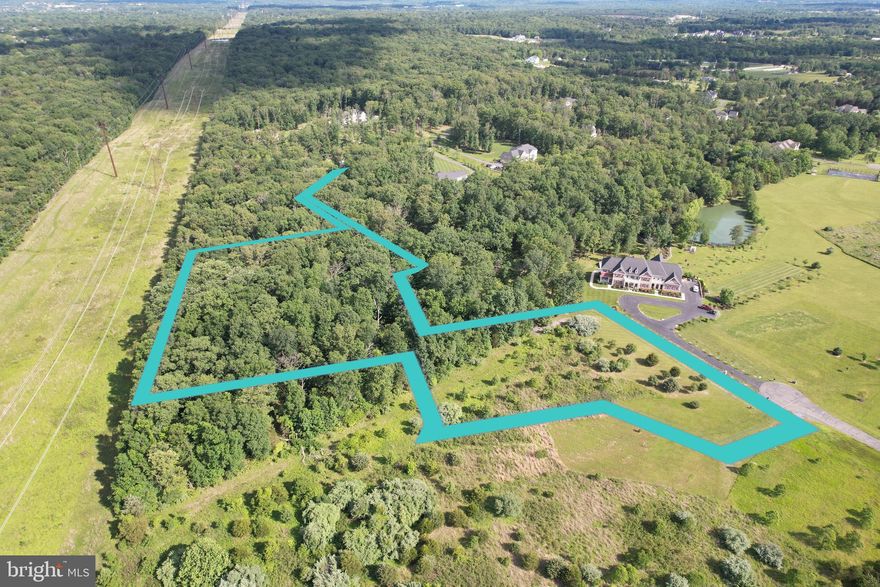 Exquisite 5.19-Acre Lot (226,077 sq. ft.) in the Prestigious Hunter’s Pond and Foxmont Community 
Seize a rare opportunity to build your dream home. This private parcel offers a serene, wooded setting surrounded by mature trees, perfect for those seeking tranquility and seclusion in a prestigious neighborhood of $ 1.5 M+ custom estates.
Property Highlights: of gently rolling terrain, providing ample space for a luxurious custom home, expansive outdoor amenities, and lush landscaping.

Zoning: RC (Residential Conservation, 030), allowing single-family homes, accessory dwelling units (ADUs), and select commercial or industrial uses for versatile development options.

Utilities: Fully equipped for modern living with natural gas, electric, and Fios available at the lot line. The lot is approved for a 5-bedroom septic system, with documentation available, ensuring readiness for your dream home.

HOA Benefits: Part of the Hunter’s Pond and Foxmont Master Association, with a modest monthly fee of $255.30 covering trash and snow removal, maintaining the community’s pristine and upscale appeal.

Annual Taxes: Approximately $5,550 (2025), offering reasonable carrying costs for a lot of this size and prestige.

Located in the heart of Fairfax County, this lot combines the best of both worlds: a peaceful, private retreat with convenient access to major commuter routes like Route 29, I-66, and I-495. Tucked away in the equestrian-friendly Hunter’s Pond and Foxmont community, horse lovers will delight in direct access to over 20 miles of nearby riding trails, perfect for leisurely rides or adventurous outings. The property’s serene setting, surrounded by mature trees and nestled near quiet cul-de-sacs, creates an idyllic backdrop for your custom estate.

Families will appreciate the proximity to top-rated Fairfax County Public Schools, including Bull Run Elementary, Stone Middle, and Westfield High School. The surrounding area offers a wealth of recreational and lifestyle amenities, with Bull Run Regional Park, local wineries, shopping, and dining. This prime location strikes the perfect balance of rural serenity and urban accessibility.
This parcel is a blank canvas for creating a bespoke residence tailored to your vision, whether it’s a sprawling modern estate, a charming farmhouse, or a luxurious retreat. Surrounded by high-value custom homes, this lot ensures your investment is nestled in a cohesive, upscale community. The equestrian-friendly environment, combined with the lot’s generous size and pre-approved 5-bedroom septic system, makes it ideal for homeowners seeking both luxury and functionality. With utilities readily available, this homesite is primed for construction, offering a seamless path to realizing your dream home. Question about the loan? We have you covered.