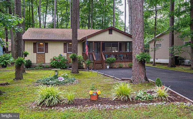 Charming coastal rancher located in Ocean Pines! Lovingly maintained by the same owners for the past 22 years, this home offers comfortable one-level living with thoughtful updates throughout. The remodeled kitchen features beautiful countertops, stainless steel appliances, a dishwasher (approx. 4 years old), and a convenient pantry. The range and dryer are brand new, and the primary bath has been beautifully renovated with a tile shower and glass doors.
Enjoy the best of outdoor living with both a welcoming front screened porch and a spacious rear screened porch overlooking the fenced backyard, complete with a custom paver patio, ideal for entertaining or relaxing. Additional highlights include a large shed, attic for extra storage, coat closet, and a newer paved asphalt driveway. The roof is just five years old, providing added peace of mind.
Located in amenity-rich Ocean Pines, where residents enjoy indoor/outdoor pools, golf, marina, racquet sports, parks, trails, and more—just a short drive to the beaches of Ocean City!