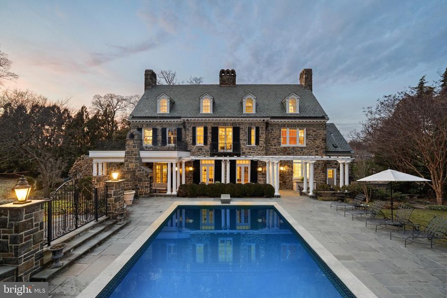 207 East Highfield Road; one of Guilford’s most treasured manors. Nestled on a double lot overlooking Sherwood gardens this property provides the perfect blend of modern design and historic charm. Pull through the gated driveway, wonder along the gardened walkways, and glide into the spacious chandelier lit foyer. Oversized windows and tall ceilings seamlessly frame every room. A graciously sized living room, renovated in 2019, fixed with dual chandeliers, venetian plaster walls and access to the back patio highlight the stately design. Flowing into the dining room, find ample seating for guests with a direct view of the back patio and large pool. Renovated in 2019, the kitchen was designed with chefs and entertainers in mind, affixed with Wolf Double-ovens a Wolf Five-burner Stove, Sharp Microwave Drawer, Sub-zero Refrigerators, and a Custom Vented Hood. A breakfast nook and family room provide additional space for a everyone in the household to gather in the heart of the home. The first floor office, which was renovated in 2019, sits just off of the family room teeming with natural light & energy. Up the grand staircase, find four large bedrooms on the second floor and an additional two bedrooms on the third floor. A primary suite, overlooking the pool and backyard, is completed with a considerable walk-in custom built closet and flows into the bathroom featuring a large dual-head standing shower and separate soaking tub. Bedrooms two, three and four all have ensuite bathrooms and custom finishes making each unique and fun. The third floor boasts unlimited potential with a great room perfectly sized for anything from a game room to a movie theater. Two additional bedrooms or flex rooms can be found on the third level.  In contrast to the rest of the home, the lower level emotes classic Guilford charm from its wood accents to the walk-in wine room, wet bar and billiards room. Down a lit set of steps, feel the ambience of Highfield’s gem of a home office, adorned with built-ins and high coffered ceilings. The backyard is an oasis in the heart of Guilford. A stone fireplace under the covered patio provides a cozy atmosphere ready for endless year round nights outside. Explore the pool surrounded by abundant seating, a full outdoor kitchen, and a pool-house featuring outdoor shower & bathroom facilities. This neighborhood staple has been lovingly cared for and updated waiting for its next residents, don’t miss the opportunity to become enchanted by 207 East Highfield Road.