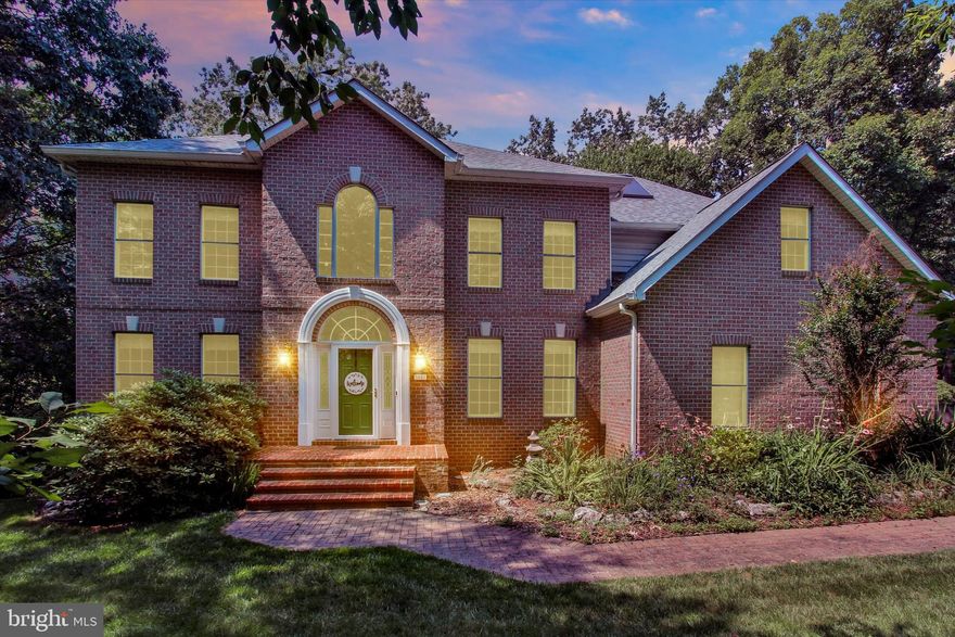 Tucked within the prestigious River Downs community, this beautifully crafted three-level residence was built by renowned Dolfield Contracting using classic Better Homes & Gardens house plans—an inspired pairing of timeless design and exceptional craftsmanship. From the moment you arrive, the home’s warmth, balance, and attention to detail are unmistakable. With four spacious bedrooms and four-and-a-half bathrooms, the layout offers both gracious entertaining spaces and comfortable retreats for everyday living.

Throughout the home, meaningful improvements provide confidence and care, including a new radon mitigation system, new septic tank, updated plumbing components, renovated fireplaces, and a recently serviced well—allowing you to move in with peace of mind. The kitchen, remodeled in 2018, serves as the true heart of the home, featuring custom quarter-sawn oak cabinetry with soft-close drawers, a fully accessible island, and modern appliances, including a garbage disposal replaced in 2023—beautifully blending function and craftsmanship.

Sustainability meets sophistication with owned solar panels generating renewable energy credits, a 500-gallon propane tank, and a dual-stage Trane heat pump with a compressor under warranty, delivering impressive efficiency without sacrificing comfort. Outdoor living shines with a generous 34’ x 12’ deck backed by a lifetime warranty—perfect for quiet mornings or memorable evenings. A 50-year roof installed in 2022, Leaf Solution gutters added in 2023, and a Big Max storage shed offer durability and ease of maintenance.

The home is surrounded by lush, thoughtfully maintained landscaping, supported by a professionally installed irrigation system with a new rain sensor covering all zones for year-round beauty. The finished lower level provides approximately 1,000 square feet of versatile living space and includes a bathroom with heated floors, creating a cozy and welcoming extension of the home. Every element reflects pride of ownership and intentional care. This is more than a home—it’s a place to settle in, gather, and create lasting memories. Schedule your private tour today.