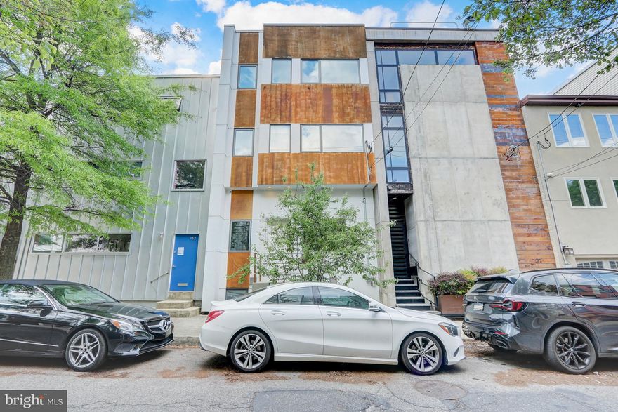 Never before offered to the public, this custom energy efficient home that runs street to street is looking for its' next steward!  Located right across from Liberty Lands in the heart of Northern Liberties, this spacious 20 foot wide home was custom designed and built by the current owners with the help of the architect Harman Deutsch.  The home is designed to passive house standards with an air-tight envelope, highly insulated walls and roof, and an Energy Recovery Ventilation system for lower energy bills and improved air quality.  This home encompasses 2640 sq ft over 3 levels plus 800 sq ft of finished space below ground, a finished 800 sq ft rooftop terrace, and a large 1200 sq ft garden with two parking spots.  
Entering the front door, you are welcomed into a  modern dining area and a fantastic open kitchen with lots of cabinetry/storage.  Past the open tread and metal railing staircase, you find an oversized light filled living room.  Large sliding doors lead out to the garden featuring mature greenery and  native perennials.  The garden was designed by a Philadelphia landscape company utilizing native plants to support local wildlife. Past the outdoor living area are two gated parking spaces. Upstairs,  the 2nd level features 2 oversized bedrooms with large sunny windows and sizable closets.  You'll also find a full hall bath and a large laundry room.  The 3rd level features an expansive primary bedroom featuring west facing windows with views of the garden and park, and a wall of closets for plenty of storage.  The primary bathroom features double vanities, rain head walk-in shower, and a separate soaking tub.  On this level are 2 more bedrooms that also make great offices or work-out rooms.  The basement has been finished to make a movie/den room with   a projector mount and a 7.1 surround sound system , a powder room and separate storage area.
Features throughout the home include 10'+ ceiling height, concrete floors on the main level and engineered maple flooring on upper levels.  The bathrooms have been finished with Portuguese cement board walls and porcelain tile flooring.  Continuing up to the roofdeck level, you will find two connected outdoor living spaces both with panoramic views of the Philadelphia skyline.
This home is a unique urban oasis with its spacious living, excellent noise insulation thanks to highly insulated walls and triple-pane windows, an isolated rooftop terrace to relax and entertain, and a secluded garden on the park. You are just steps from the community friendly Liberty Lands park and the neighborhood favorite One Shot Coffee, not to mention the convenience of grocery, shopping, and nearby restaurants.
Custom homes like this don't come up often so make your appointment today before it's too late!