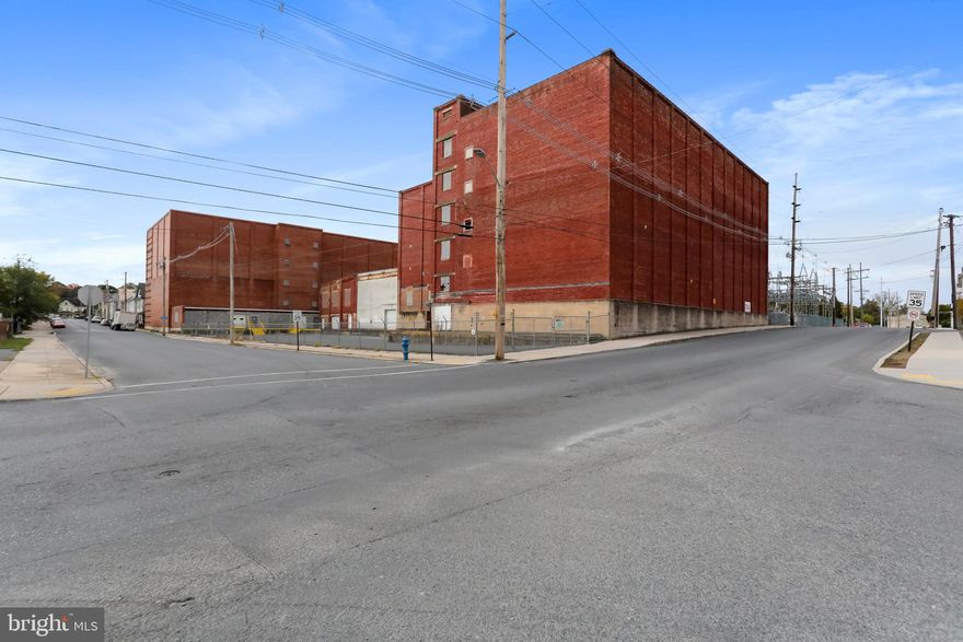 REDUCED TO SELL!!!!   GREAT OPPORTUNITY! 2 Separate WAREHOUSES side by side, separated by Falling Springs Creek. Each unit offers 100K sqft, brick construction, One is completely updated with new roof in 2023 and features 5 floors each with 20K sqft. This warehouse is up to code and has two sets of stairs PLUS a 8,000LB freight elevator, fire/smoke alarm system. 2 loading docks zoned for commercial use. Operate/manage one unit while you restore the other!