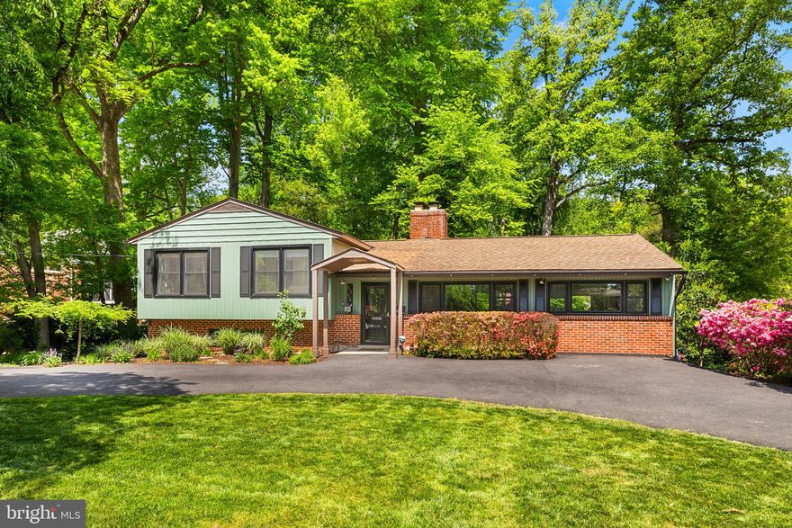 ULTIMATE LAKE LIFESTYLE | $250K+ RENOVATIONS | TWO BLOCKS TO THE BEACH Modern luxury meets Lake Barcroft serenity at 6354 Lyric Lane. Perfectly positioned just two blocks from one of the lake’s best private beaches, this home offers the rare combination of classic Lake Barcroft charm, thoughtful modern renovations, and a lush, private setting in one of Northern Virginia’s most convenient locations. Set on a one-third-acre lot, this five-bedroom, two-bath home lives larger than expected, with an estimated 2,950 square feet across multiple levels, a circular driveway, expansive outdoor living spaces, and a serene backyard framed by mature trees and established landscaping.

Transformed by over $250,000 in meticulous upgrades, this beautifully updated residence defines turn-key luxury. The heart of the home is a stunning, expanded designer kitchen (2022) featuring custom white oak cabinetry, a ZLINE professional range, and solid white oak hardwoods. Beyond the aesthetics, enjoy the rare luxury of total peace of mind with a whole-house Generac backup generator (2024) and new, energy-efficient windows (2025).

The flexible floor plan provides excellent bedroom separation and versatility. The upper level features three bedrooms and an expanded, fully remodeled bath with a wood vanity, quartz countertop, two-niche shower, and updated flooring and plumbing. The lower levels offer two additional bedrooms, a spacious family room, laundry/utility space, unfinished storage, and outdoor storage—ideal for guests, work-from-home needs, hobbies, or long-term organization.

Outside, your private sanctuary situated on one third of an acre awaits. Host guests on the expansive rear deck, enjoy the lush plantings under the mature canopy, relax on the brick patio, or stroll down to the lake for a sunset swim. Enjoy any number of exclusive Lake Barcroft community events, like the legendary Fourth of July fireworks, holiday parades, or the "Music on the Lake" summer concert series. This property offers a sense of serenity and retreat while remaining just minutes from DC, Tysons, Arlington, the Pentagon, and more. Welcome home to your own private escape.