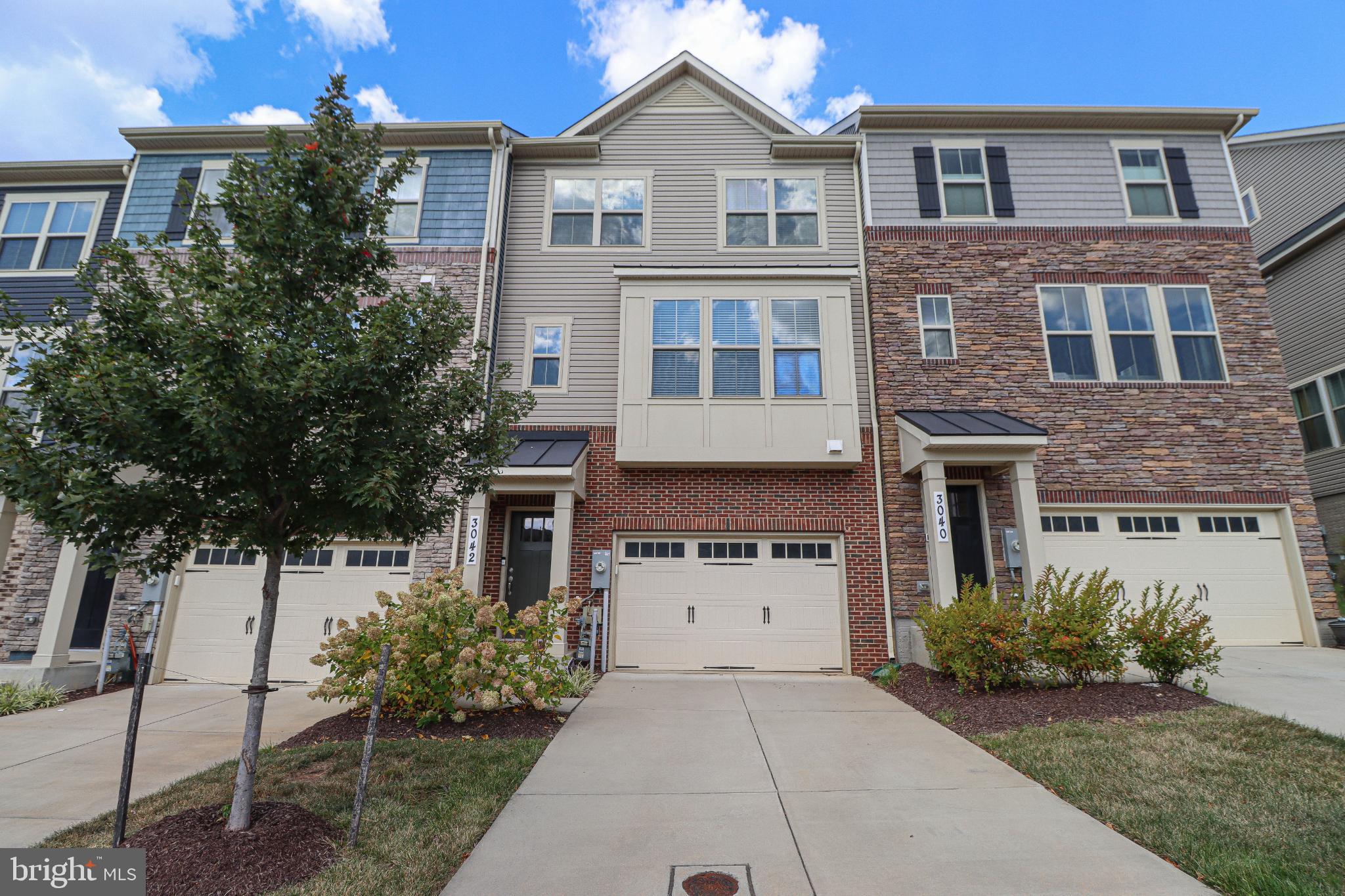 Welcome to this beautiful, like new townhome in Hanover’s highly sought-after Parkside community, just minutes from Fort Meade and major commuting routes to Baltimore, Annapolis, and D.C.
This home offers three finished levels of living space. On the main level, you’ll find hardwood floors throughout and a thoughtfully designed open layout. The kitchen has a center island, abundant cabinetry, and plenty of counter space. The adjoining dining area flows seamlessly into a large living room highlighted by a charming box bay window and an additional nook—perfect as a home office, play area, or cozy entertainment corner. A convenient powder room completes this level.
Upstairs, the primary suite features a spacious walk-in closet, and a private bathroom with a separate toilet closet. There are two additional bedrooms and a second full bathroom, plus upper level laundry!
The lower level includes a versatile recreation room, has a second powder room, and a 'mudroom' area with direct access to the garage. The garage offers flexible parking for two compact cars or an oversized single vehicle, plus plenty of room for storage.
Fall in love with this location in Parkside—offering community amenities and close proximity to Fort Meade, BWI, shopping, dining and more!