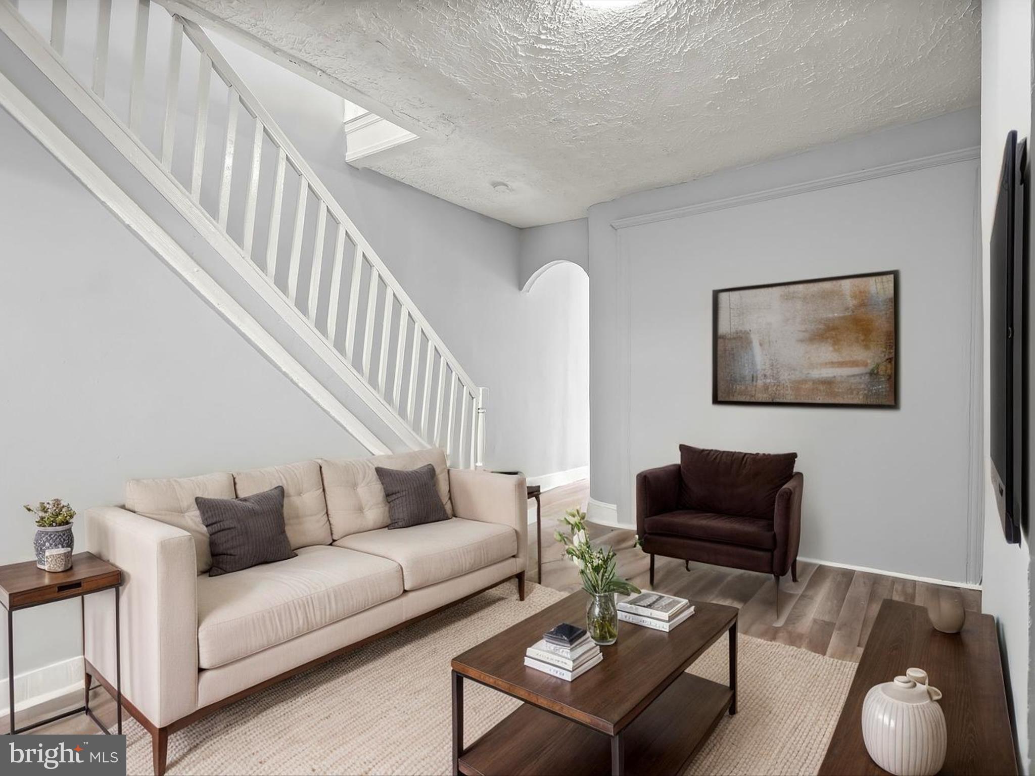 This 4-bedroom, 1.5-bath home offers historic details and practical updates, including a fresh neutral color palette throughout, new stair carpet, and a newly installed cement rear patio. The entry vestibule retains its original tile, leading to the main level with newer wood-look vinyl flooring for easy upkeep. A bright bedroom sits at the front of the home, followed by a living room that opens to the kitchen with a gas range and granite countertops. From here, step out to the fenced rear patio, a potential parking pad. A half bath completes the main level.
Upstairs, a skylight brings light to the hallway connecting three bedrooms and a full bath with a tub/shower combination. The unfinished basement provides plenty of storage space and laundry area.
The location offers convenient access to Patterson Park, the Highlandtown arts and shopping district, Oriole Park at Camden Yards, and Lexington Market. Nearby public transit options include the Johns Hopkins Metro station and the Charm City Circulator.
Enjoy city living with green space, local culture, and everyday conveniences right at your doorstep in Patterson Park.
Note: Select interior photos have been virtually staged.