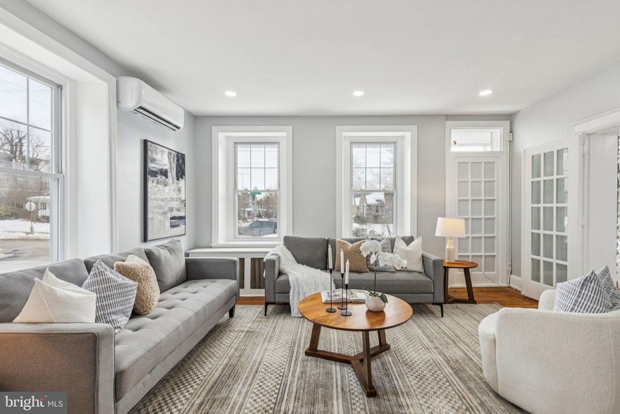 Welcome to 433 E. Gorgas Ln, a beautifully reimagined Mount Airy home where a full, top to bottom renovation has been thoughtfully completed, preserving the home’s original character while seamlessly integrating modern upgrades throughout. From restored architectural details to high-end finishes, this residence offers timeless charm paired with contemporary comfort.
Enter through the grand, light filled foyer, setting the tone for the home’s elegant layout. To the right, original French doors open into a spacious dining room, ideal for both everyday meals and formal gatherings. The dining room flows effortlessly into the brand new, expansive kitchen, designed to impress with abundant cabinetry and storage, quartz countertops, and two skylights that flood the space with natural light. The exposed Wissahickon schist stone in the kitchen provides a beautiful contrast of historic character to the space. This level also includes a convenient half bath and laundry closet. From the kitchen, step outside to a generous rear yard, complete with a detached two car garage and driveway.
Back through the foyer, the left side of the home opens into a large, sun-drenched living room, perfect for entertaining. Beyond the living room, the enclosed sunroom is surrounded by floor to ceiling windows and anchored by a cozy gas fireplace, creating a warm and inviting retreat year round. From here, access the private rear porch, featuring a charming hanging bench, an ideal spot to relax and unwind.
Upstairs on the second floor, you’ll find a versatile first bedroom, perfect for a home office, nursery, or guest room, along with a fully renovated hall bathroom featuring a tub/shower combo and all new fixtures and finishes. The primary suite is spacious and filled with natural light, offering a true retreat. A custom walk-in closet transitions into the luxurious primary bathroom, highlighted by a generous walk-in shower with marble floors, elegant green Spanish tile, gold accents, and a double vanity.
The third floor offers two additional bright bedrooms, connected by a fully updated Jack-and-Jill bathroom with a beautifully tiled walk-in shower and a vanity designed for convenience with outlets hidden inside.
The unfinished basement provides ample storage space and houses the home’s utilities.
Throughout the home, original hardwood floors have been restored, all new electrical wiring has been installed, and recessed lighting and mini-split AC/heat units have been added in each room to complement the home’s radiator system, delivering comfort without sacrificing character.
Located on a beautiful, tree lined block, this exceptional corner home is conveniently located near Mount Airy Village and the Germantown Avenue corridor, with easy access to Awbury Arboretum, the Wissahickon, Weaver’s Way Co-op, and SEPTA’s Chestnut Hill East Line for easy commuting. A rare opportunity to own a fully renovated classic in one of Philadelphia’s most beloved neighborhoods. Schedule your tour today!