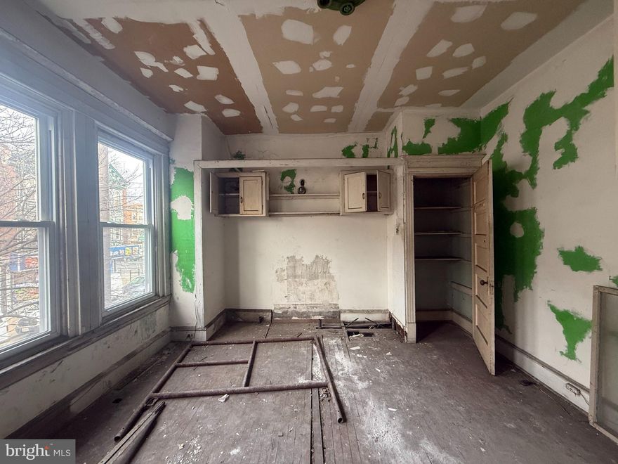 This CMX3-zoned 2700sqft quadruplex rowhome with an unfinished basement presents a lucrative investment opportunity, featuring a first-floor commercial unit with a pro forma rental rate of $1500-  $2,000 per month, along with FOUR legally zoned 1BD/1BA residential units upstairs, each offering rental potential between $950-$1,000+ per month (depends on your finishes). While structurally as verified by a structural engineer which the bone still in a good shape. Located in an OZ, it provides potential tax-deferred benefits and a higher ROI.  Only cash or construction loans will be accepted. Showings are by appointment only, FLASH LIGHT is needed, please with additional time needed for seller response while seller travel internationally. Please do your own due diligent. Apts have different entrance with the commercial space. No Sign on the property, please do not enter without appointment.