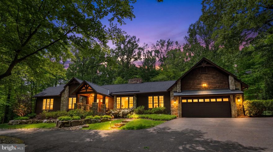 One-level luxury living at its absolute finest. Tucked on a private, tree-lined lot, this stunning, beautifully updated home delivers unforgettable wow moments at every turn. Soaring ceilings, rich hardwood floors, and dramatic architectural details create a space that feels elevated, warm, and completely unique.
Major updates include pool liner and pump (2025), fully renovated primary bath, laundry, and half bath (2025), hot water heater (2021, flushed 2026), roof and gutters (2019), skylights (2019), HVAC (2016, recently serviced with dehumidifier added), and windows, sliders, and front door (2007).
At the center, the chef’s kitchen is a true showpiece with high ceilings, custom dark wood cabinetry, expansive granite countertops, a massive center island, peninsula seating, and additional table space—all designed for effortless entertainment.
The living and family rooms are anchored by a breathtaking floor-to-ceiling double-sided stone fireplace, creating two distinct yet equally inviting spaces. The primary suite is its own private retreat with a fireplace and a fully renovated spa-like bath featuring a soaking tub, oversized glass shower with stone surround, and dual vanity.
Step outside to a true resort-style backyard with a pool surrounded by stone, a fully equipped outdoor grilling station and bar, expansive flat grassy space (over 3 acres), complete privacy from mature trees and backyard fully enclosed with a fence. The screened-in porch is a showstopper, featuring vaulted ceilings and a wood-burning floor-to-ceiling stone fireplace, one of the most charming and unforgettable spaces in the home.
Thoughtful layout with separate bedroom wings complete this one-of-a-kind property designed for both everyday living and exceptional entertaining with the primary bedroom and fully renovated bath on one wing of the home and second wing is complete with a bedroom with an en-suite bath that’s fully renovated and two additional bedrooms that share a bathroom with a beautifully updated hall bath with stone floors, a glass shower, updated vanity, mirror, and lighting.