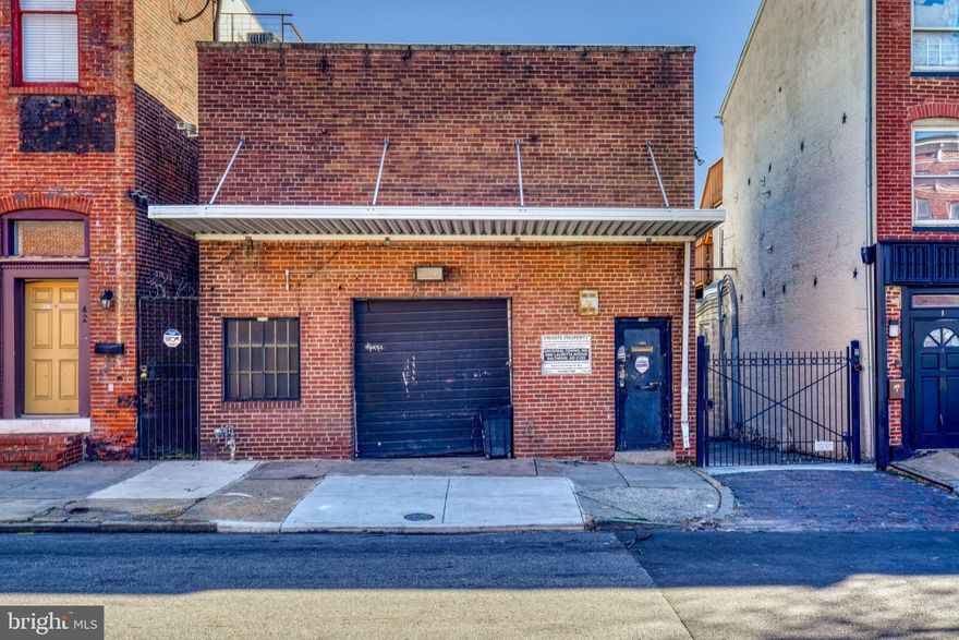 Terrific opportunity in an affordable price range, located just steps from the newly renovated, soon to be opened Hollins Market.  This space offers a roll up garage door leading into the first floor and useable space in the rear of the building.  The upstairs can be used as an office or studio apartment.  Perfect for a user who wants to live a above their business.  Property lends itself to a variety of purposes including contractor office, landscaping, storage, or renovate into an office or retail spot.  Located in Federal Opportunity Zone