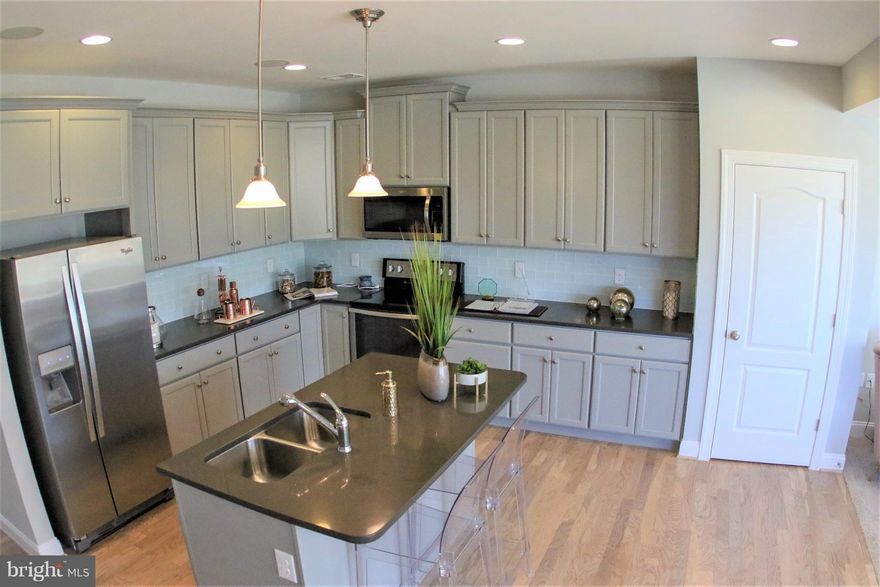 June Move-In on this stylish Litchfield townhome plan in South Berkeley County.   Features island kitchen with granite tops, maple cabinets & stainless appliances, big bedrooms, upstairs laundry, patio for outdoor living, storage shed. Everyone needs a garage! Lots of energy saving features. One of the best commuter locations in the area.