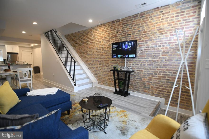 If you're looking for city living, look no further!!  Welcome home to this beautifully renovated 2 bedrooms, 2 full bathrooms row house in Washington Village-Pigtown.  This beautiful home was fully renovated in 2018 with more updates and improvements in 2020.   Enjoy the open concept main level with 9+ foot ceilings, exposed brick, gourmet kitchen with granite countertops and stainless steel appliances.   On the second level, enjoy an owner's suite spa style full bathroom,  full capacity stackable washer and dryer and a spacious second bedroom.   The back of this spacious Pigtown home boasts a deck off of the kitchen giving you room for grilling or outdoor entertaining.  There is also a parking pad for your privacy and parking convenience. The clean, unfinished basement provides the ideal storage space.    You will love the convenience of Downtown living as this house is just a few short blocks to M&T Bank Stadium, Camden Yards, Carroll Park, Federal Hill and the Inner Harbor.  Take advantage of the  Live Near Your Work neighborhood grant program for closing costs and down payment assistance.  Contact me for more information or to schedule a showing!