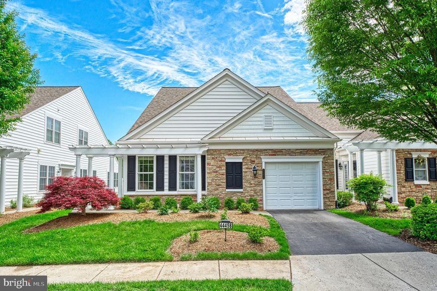 You can feel the happiness the moment you walk into this lovely end-unit villa home in the "highly sought after" Potomac Green community. The open floor plan, large windows, and sunroom leading to the outside patio allows maximum natural light. The gourmet kitchen features granite countertops, stainless steel appliances, and a perfect corner for casual dining. The sunroom is sure to be a favorite with all of the windows and view of the green space with mature trees and a walking trail behind the home. This house sits on one of the prettiest and most private lots in the community. The sunroom leads to the outside patio, which is the perfect place for a table and chairs. The sizeable primary suite has a HUGE walk-in closet and a beautiful bathroom with double sinks, shower, and separate water closet. The second bedroom and full bath are located on the opposite side of the main level  providing plenty of privacy and space for guests. A private office, continuous dining and living room space and laundry room complete the main level of this lovely home. The second level of this home has a third bedroom, third full bathroom and an open loft space perfect for game nights and watching TV. This home also has a one-car garage allowing easy access into and out of the home. There are plenty of updates to this home: The hot water heater was replaced in 2024, the washer & dryer, refrigerator, stove and microwave were replaced in 2022. The furnace and whole house humidifier were updated  in 2022, the roof was replaced approx. 5  years ago, and the AC approx. 8 years ago. There are many reasons to love the community where this home resides. Potomac Green is an award-winning gated 55+ Active Adult community that offers many amenities. Including an exercise room, indoor pool, outdoor pool, tennis/pickle-ball courts, community gardens, etc., and lots of planned activities. You can walk to One Loudoun with its many shops and restaurants and it is only a short distance to the Dulles Airport, the Metro, and the INOVA Loudoun Hospital. Make this beautiful home yours! *Active Adult 55+ Community*