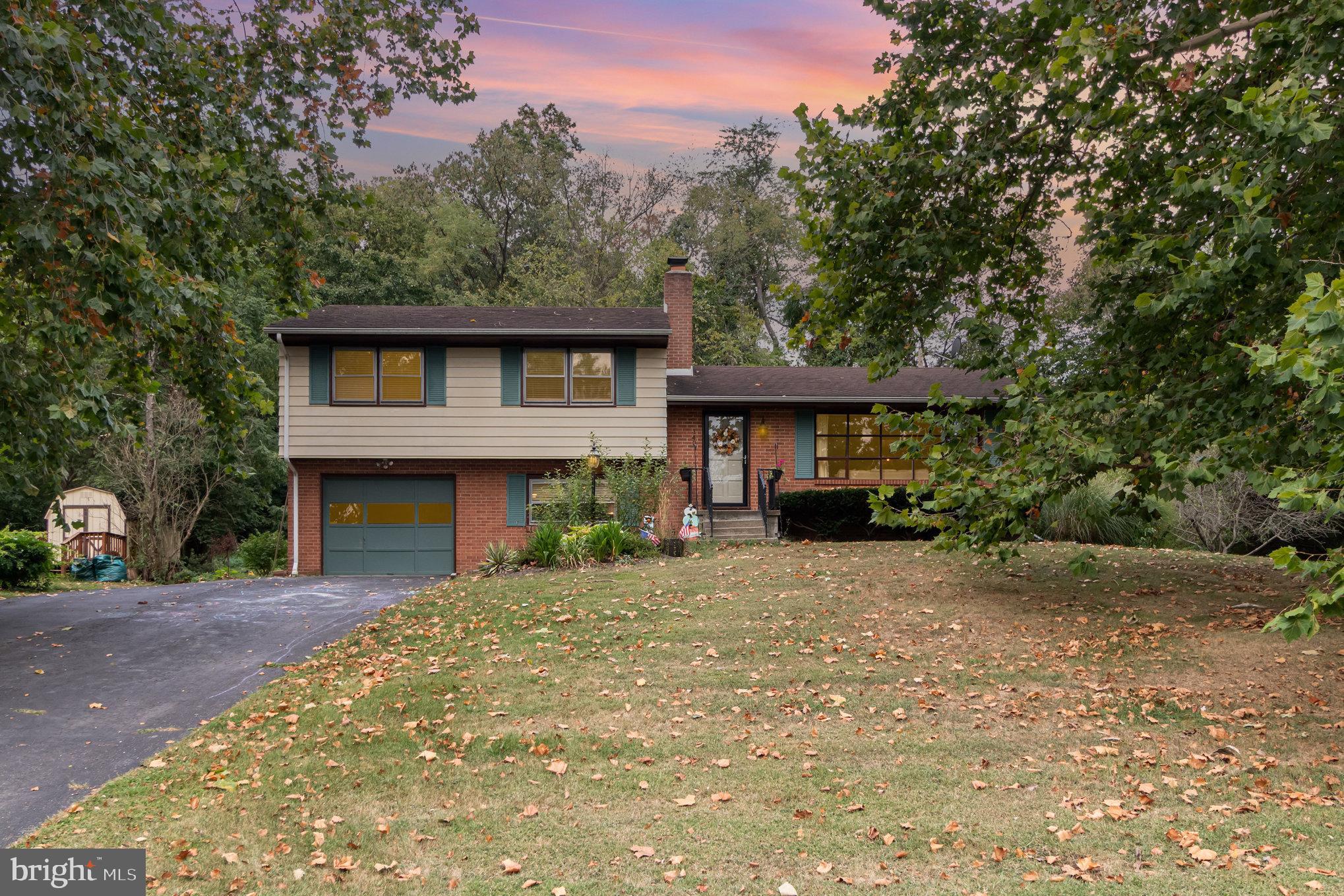 Welcome to this beautifully updated 4-bedroom, 2-bath split-level home on nearly an acre (.78) in Carlisle, PA. This prime location offers the best of both worlds, peaceful neighborhood living with convenient access to downtown Carlisle, local shops, dining, schools, and major highways for an easy commute. Inside, you’ll find fresh paint and all-new flooring, including hardwood in the bedrooms, living, and dining areas. The kitchen features new stainless steel appliances, while the upper level boasts 3 spacious bedrooms and a modernized full bath. The lower level offers a cozy family room with a wood-burning fireplace, plus a finished area with a 4th bedroom and flexible space to fit your lifestyle. Outdoor living shines with a newly added deck, screened porch, and patio, perfect for entertaining. The large backyard with fire pit area provides room to relax, gather, and enjoy. Recent upgrades include a new hot water heater, new window blinds, and a mini-split system on the main level for added comfort. This move-in-ready home combines space, style, and a great Carlisle location. Don’t miss your chance to make it yours!